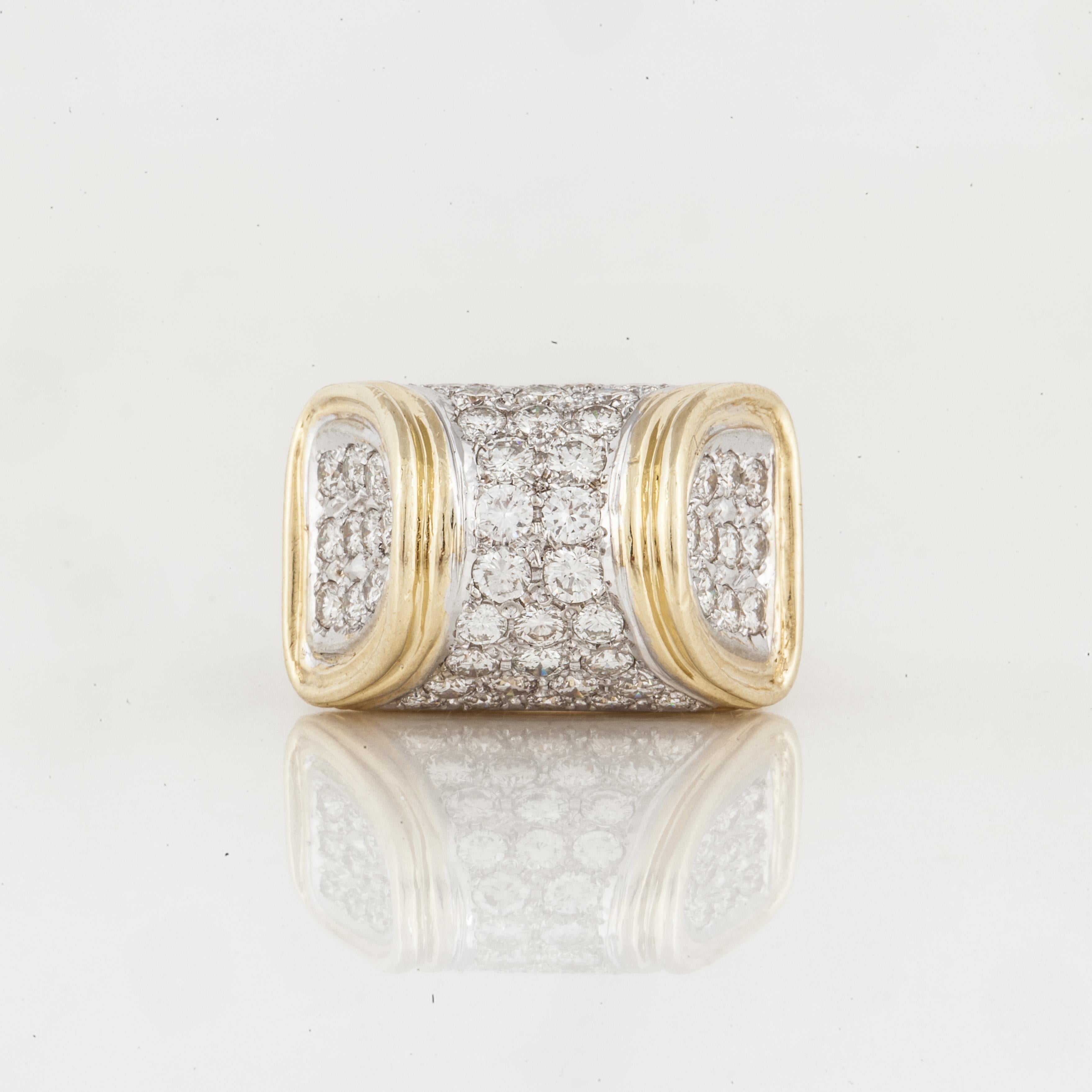 18K yellow gold ring with pavé diamonds.  It features 56 round diamonds with a total carat weight of 4.50; G-H color and VVS2-VS1 clarity.  Measures 15/16 inches long, 5/8 inches wide and stands 5/8 inches off the finger.