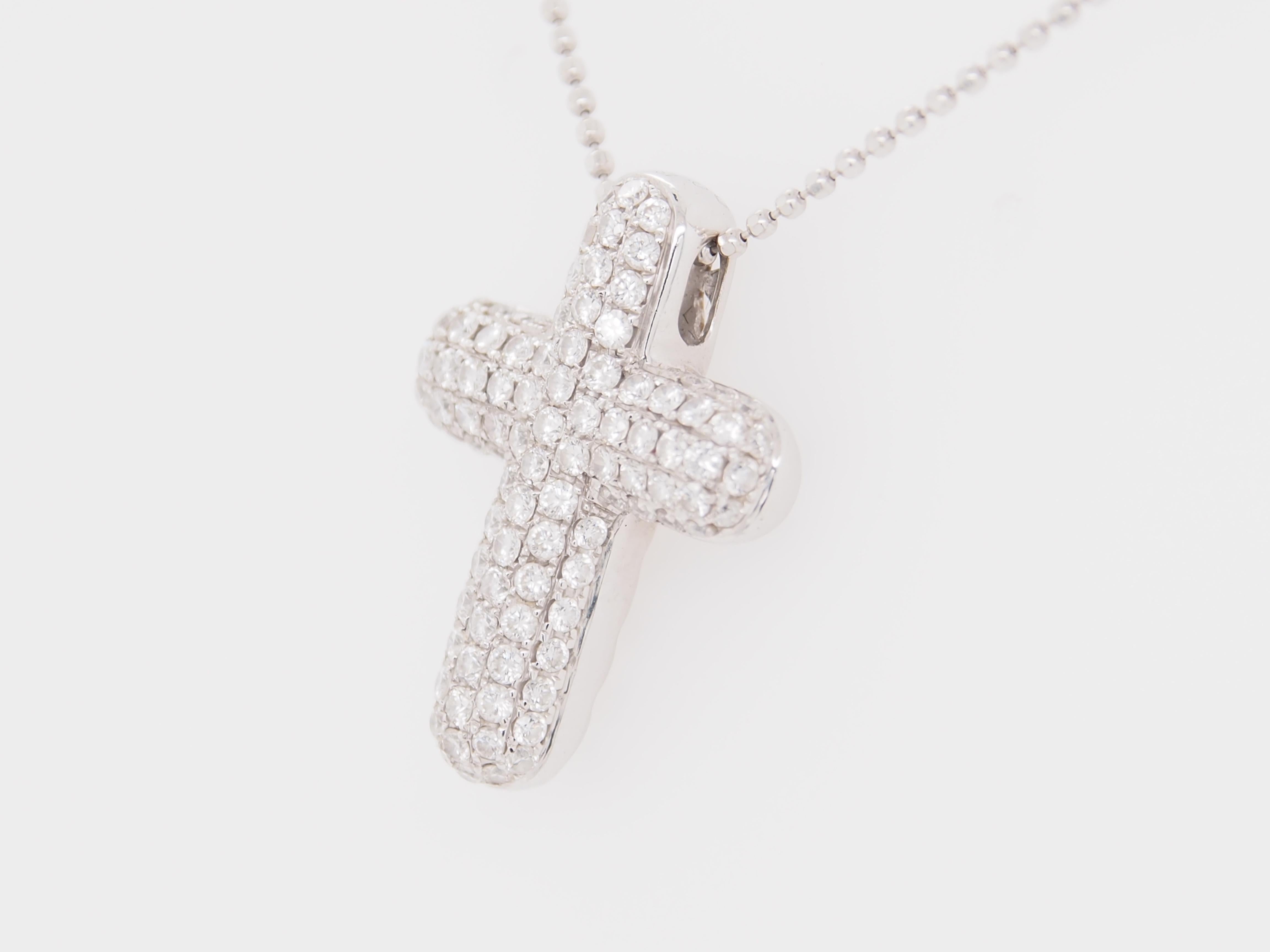 This is a delightful 18K White Gold Necklace with a Puffy 3/4 inch Cross sparkling with approximately 0.75ctw Round Brilliant Cut Diamonds, G-H in Color, VS in Clarity. The Charm is signed 