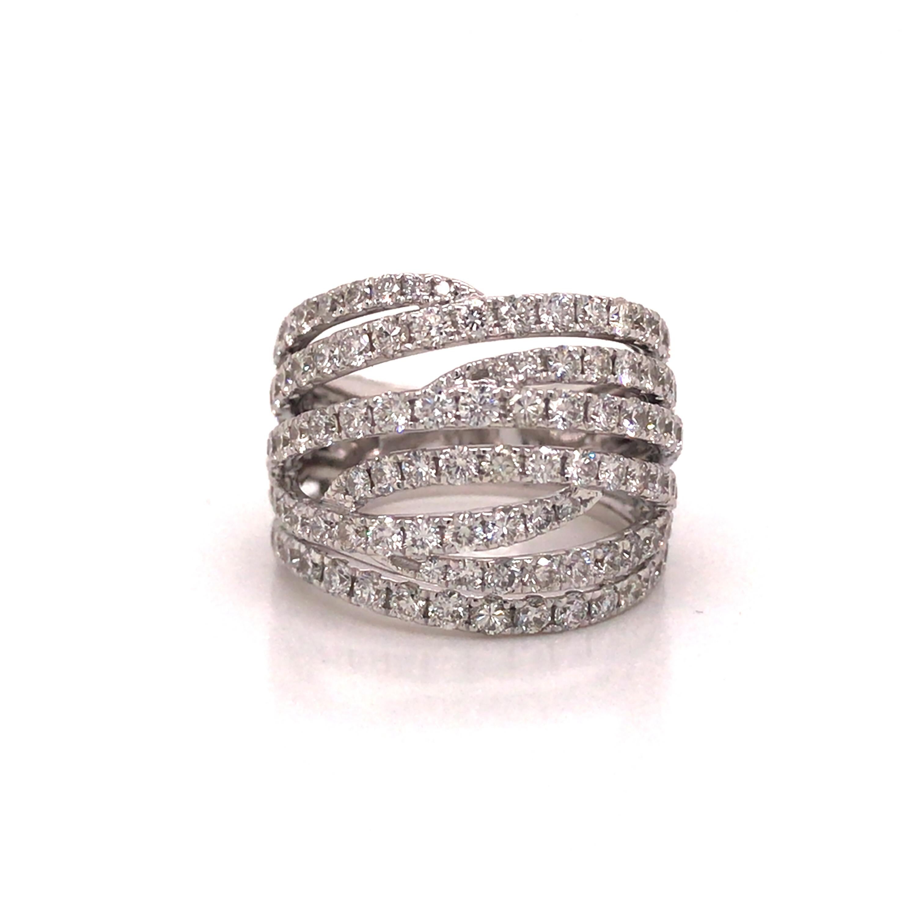 Diamond Crossover Band in 18K White Gold.  Round Brilliant Cut Diamonds weighing 3.05 carat total weight, G-H in color and VS-SI in clarity are expertly set.  The Band measures 5/8 inch in width.  Ring size 6. 9.33 grams.