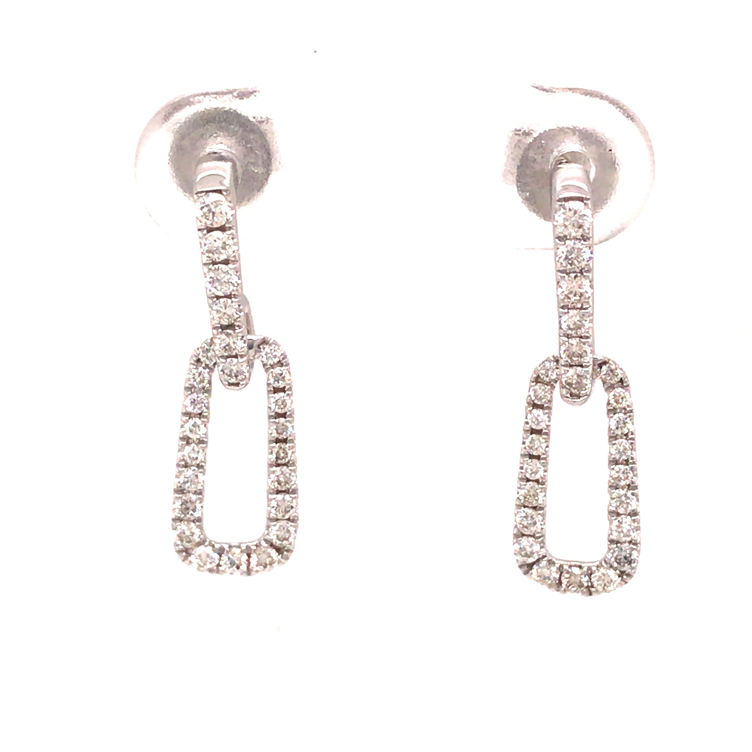 Diamond Dangle Earring in 18K White Gold.  (50) Round Brilliant Cut Diamonds weighing 0.45 carat total weight, G-H in color and VS in clarity are expertly set.  The Earrings measure 3/4 inch in length and 1/4 inch in width.  2.30 grams.