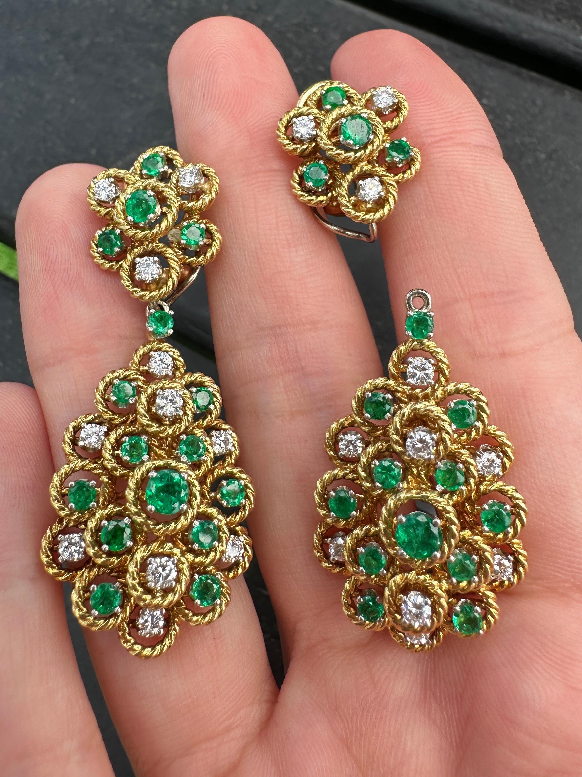 Elevate any ensemble with these stunning 18k Diamond & Emerald Day/Night Earrings. Crafted in 1960's, these earrings feature shimmering 1.00 carats of diamonds and vibrant 1.50 carats of emeralds. Made of 18k yellow gold, these 2 inch x 0.75 inch