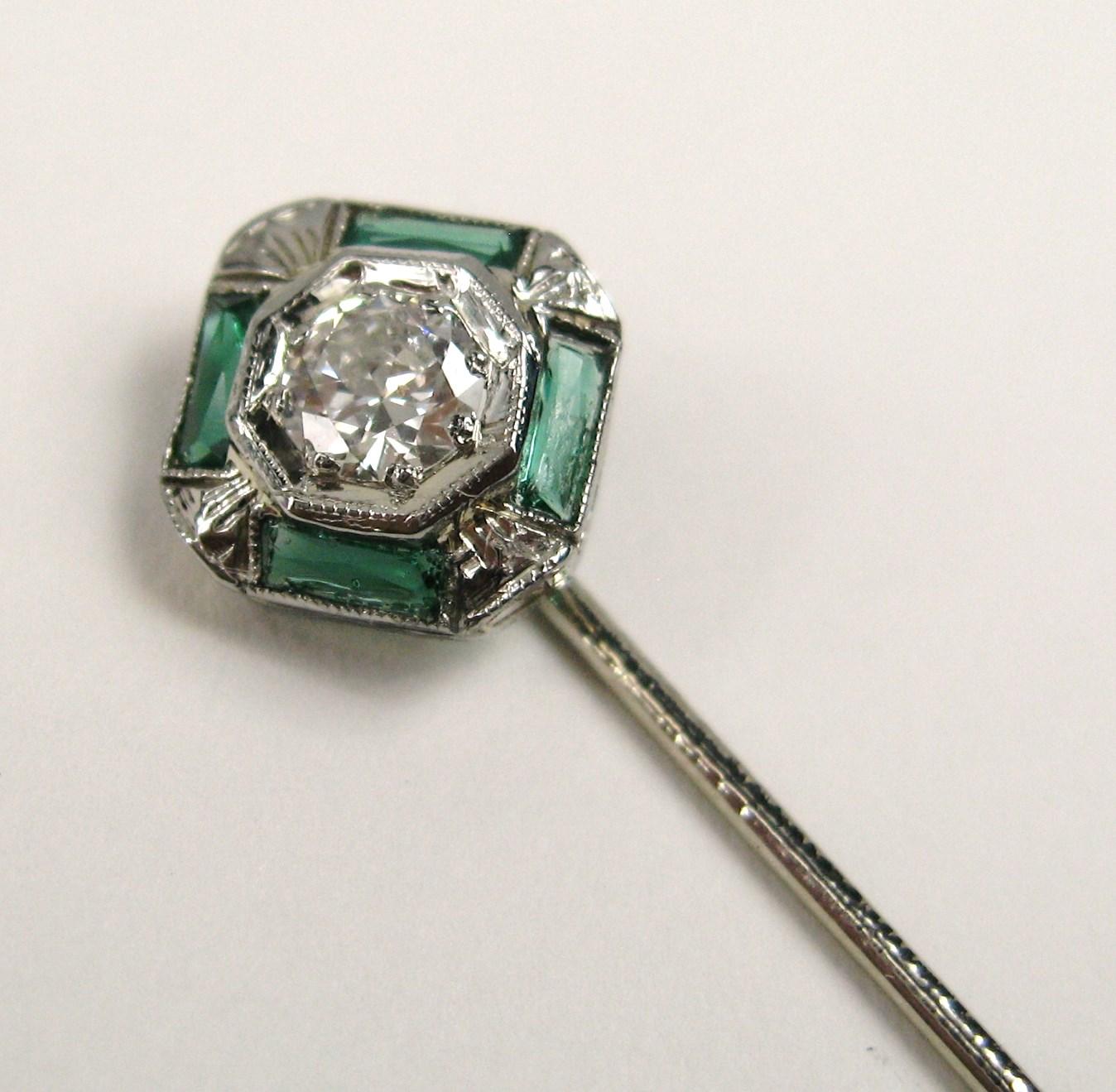 Antique Emerald and Diamond stick pin. Emerald and Diamond set in 18K White Gold. The diamond is approximately .30 of a Carat and is clarity of SI and G-H in color. Stunning piece! Measuring .34