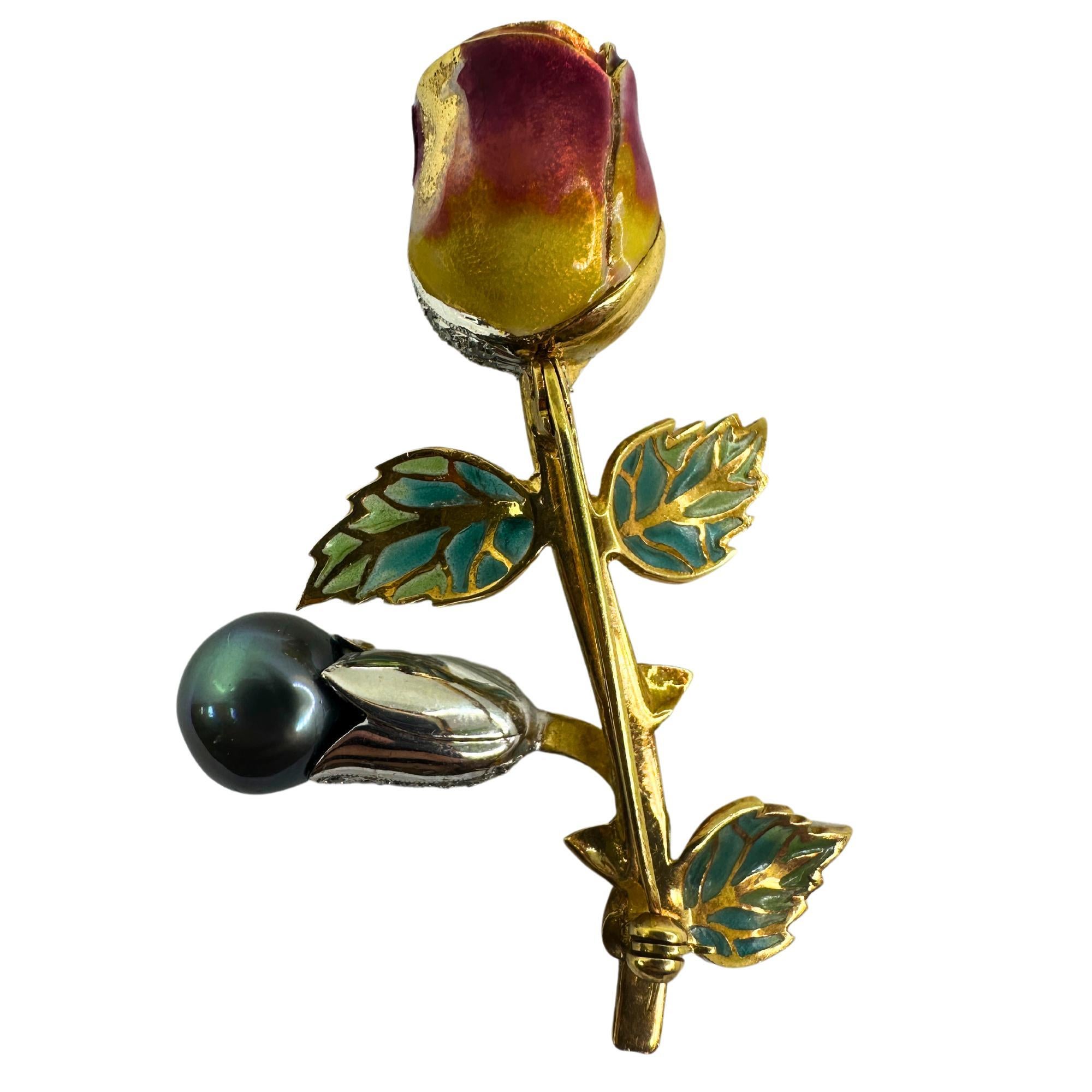 This 18K Diamond, Enamel and Pearl Rose Flower Brooch is a stunning piece of jewelry. Made with 18k yellow and white gold, it features delicate enamel detailing and a beautiful pearl. Adorned with 0.76 carats of diamonds, this brooch will surely