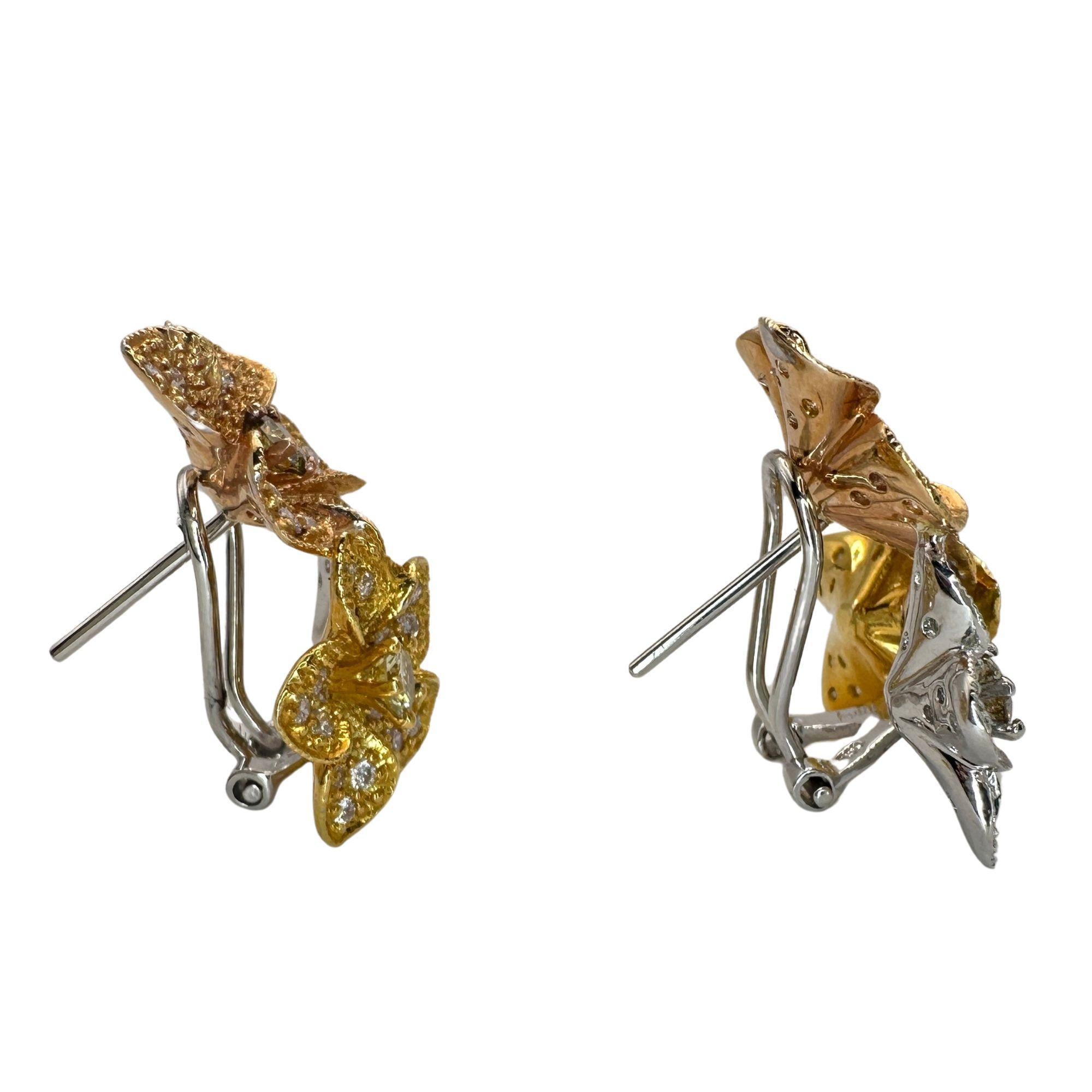These stunning 18k Diamond Floral Earrings feature a total of 2.19 carats of sparkling diamonds, including a 0.90 carat yellow diamond and 1.29 carats of white diamonds. Crafted in 18k white, yellow and rose gold, these earrings are in excellent