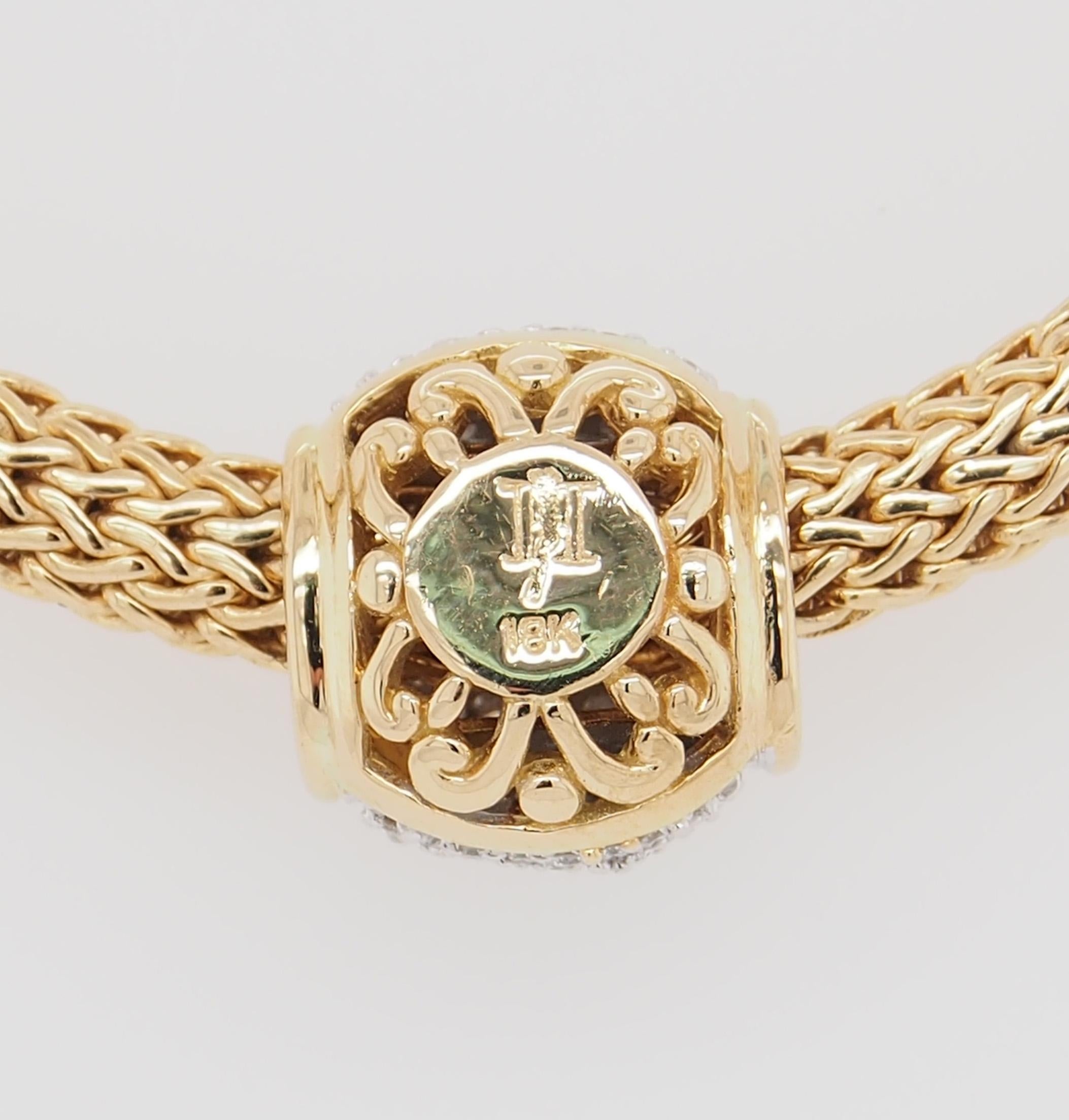 A classic John Hardy woven chain with a pave diamond slide pendant. Approximately .80 carat total weight H in color VS in clarity. 16 inches in length, 1/4 inch wide with the slide pendant measuring approximately 1/2 inch in diameter. 58 grams.

