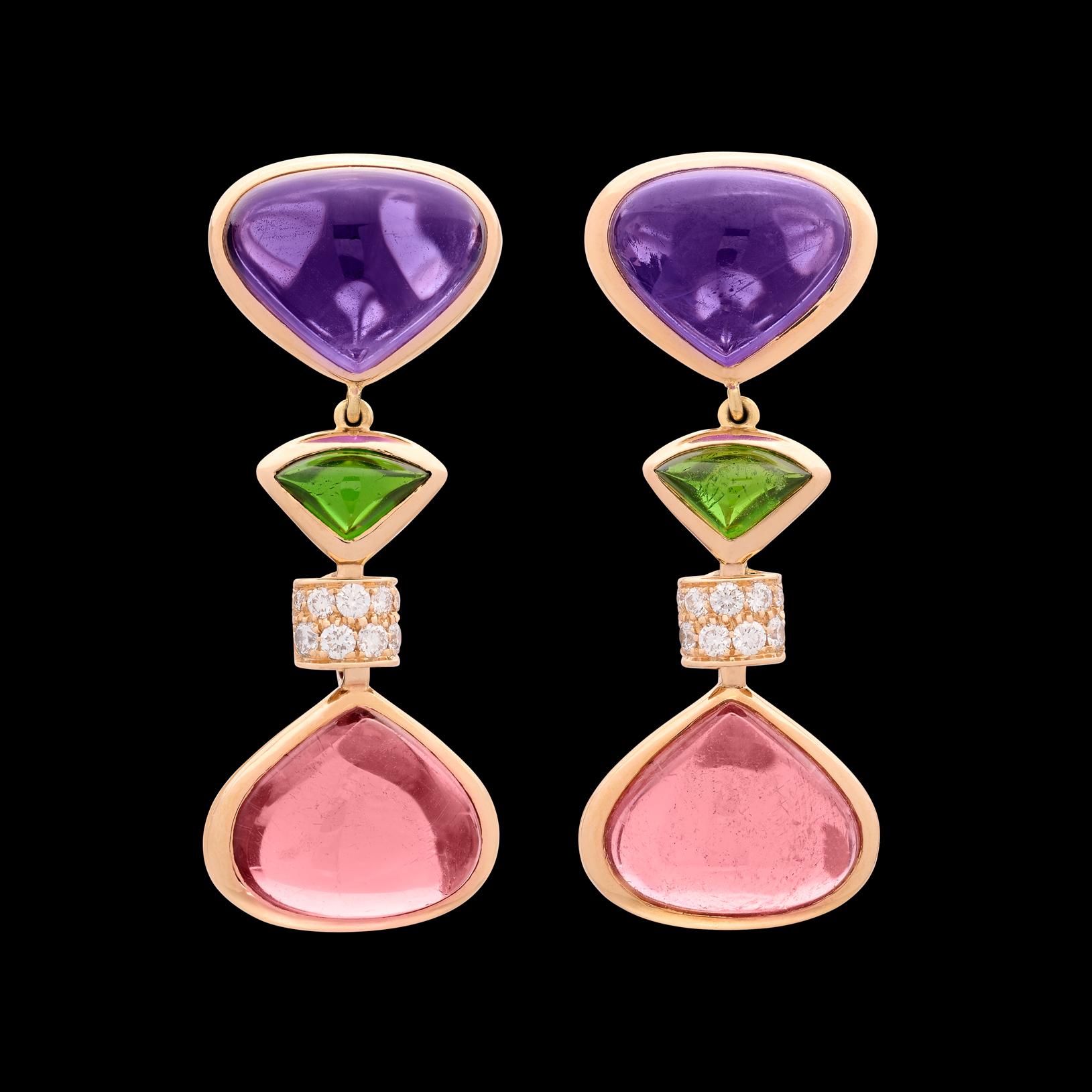 Marina Bulgari has always been known for bold & beautiful design, and this incredible pair of earrings are no exception. Featuring 12.07 carats of pink tourmaline, 9.91 carats of amethyst, and 0.43 carats of fine white diamonds, these Marina B.