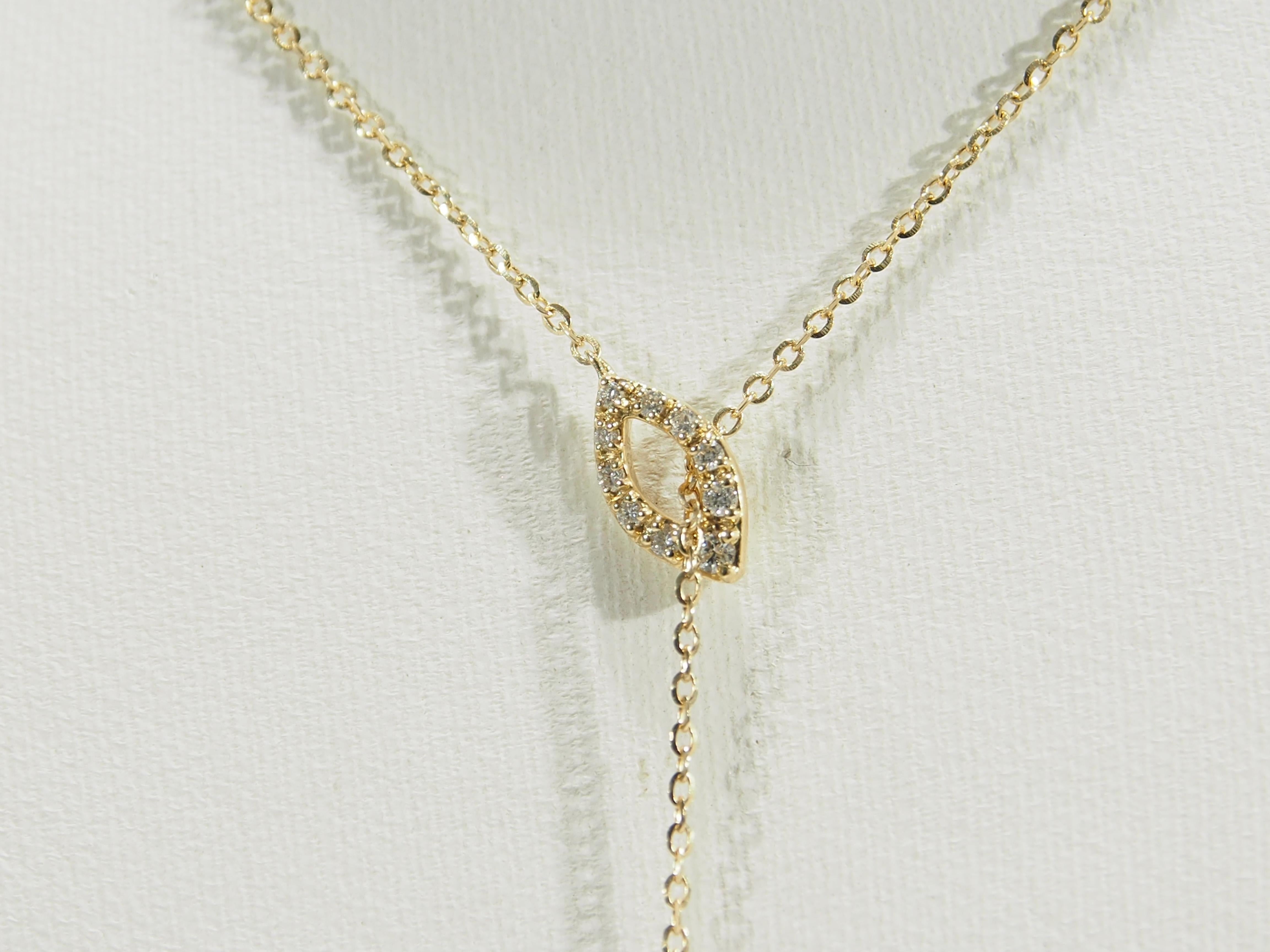 A delicate 18K yellow gold 'Y' Necklace with 2 geometric shapes set with (28) Round Brilliant Cut Diamonds G-H in color, VS-SI in clarity and approximately .41 carat total weight. The necklace is 17 1/2 inches in length with a 1 3/4 inch dangle