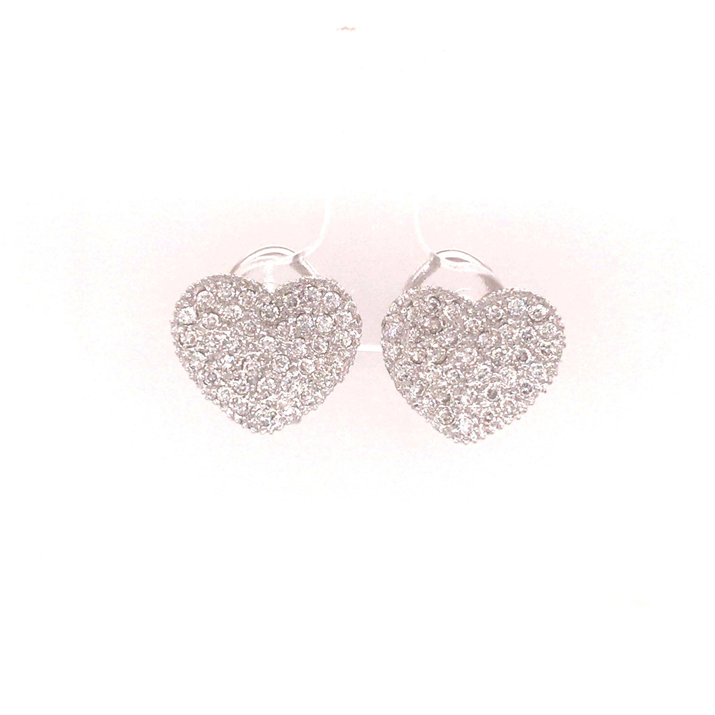 Diamond Pave Heart Earrings in 18K White Gold.  Round Brilliant Cut Diamonds weighing 2.75 carat total weight, G-H in color and VS-SI in clarity are expertly set.  The Earrings measure 9/16 inch in length and 5/8 inch in width.  Lever Back Closure.