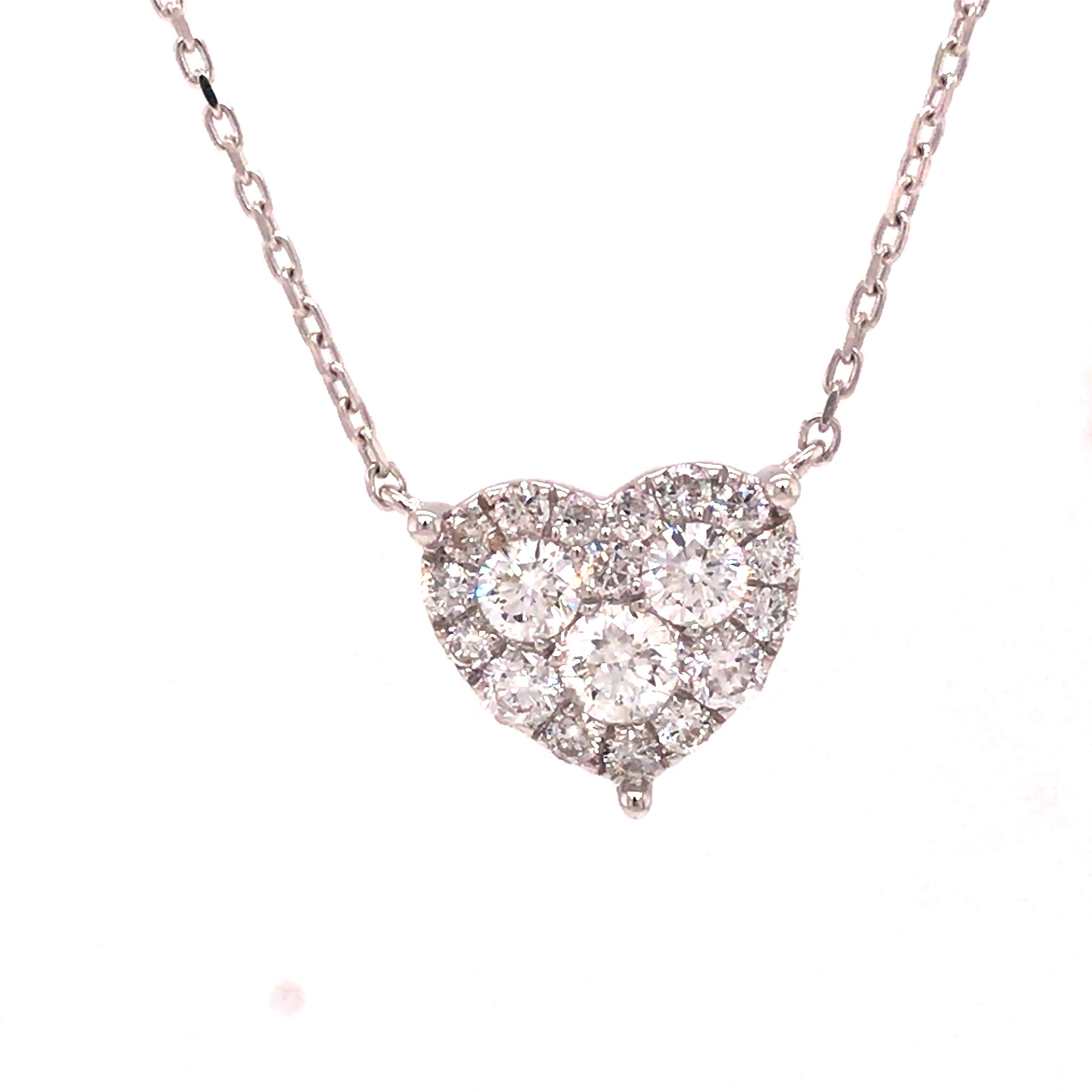 Diamond Pave Heart Necklace in 18K White Gold.  (19) Round Brilliant Cut Diamonds weighing 0.66 carat total weight, G-H in color and VS-SI in clarity are expertly set.  The Necklace measures 16 inch in length. 2.81 grams.
