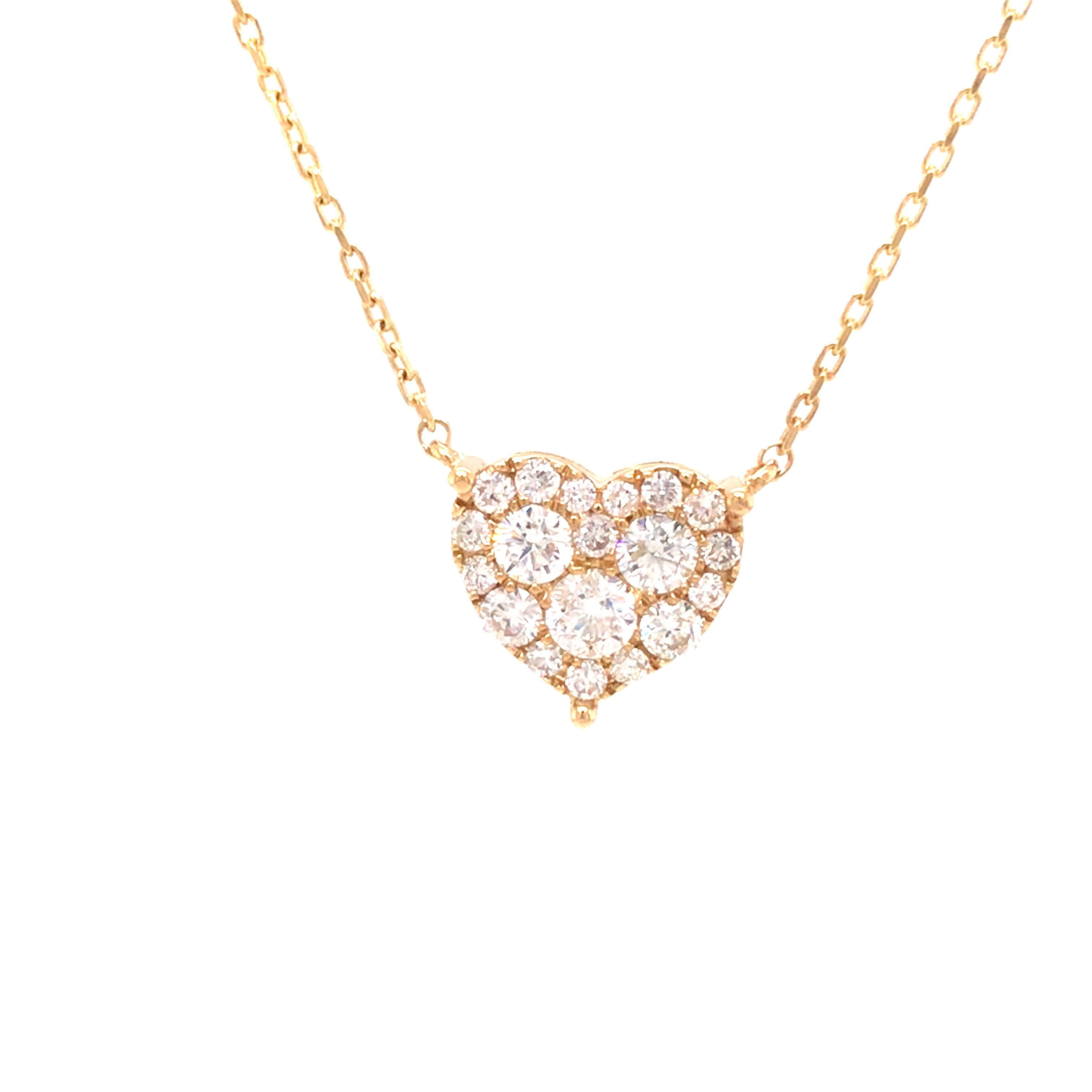 Diamond Pave Heart Necklace in 18K Yellow Gold.  (19) Round Brilliant Cut Diamonds weighing 0.66 carat total weight, G-H in color and VS-SI in clarity are expertly set.  The Necklace measures 16 inch in length. 2.81 grams.