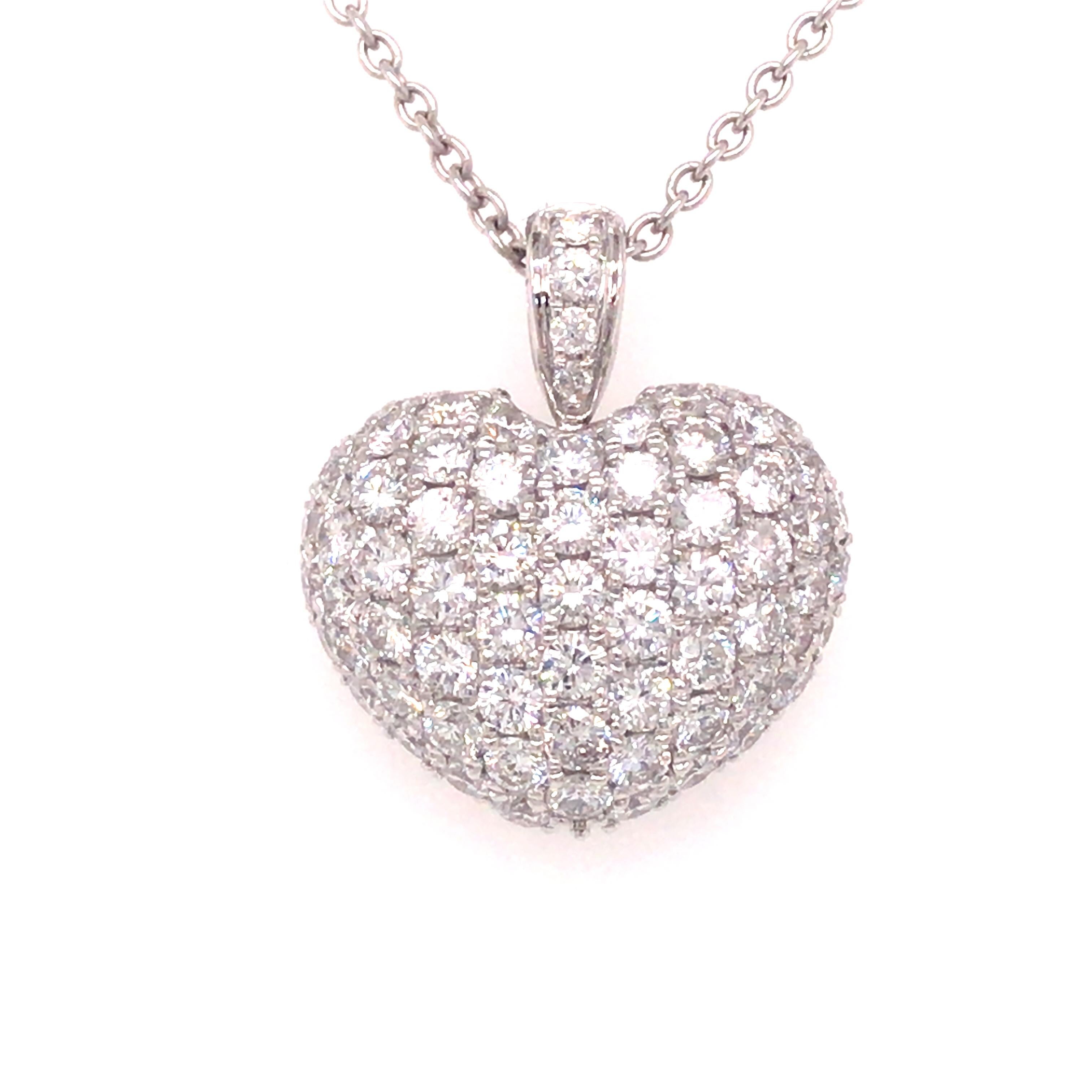 Diamond Pave Puff Heart Pendant in 18K White Gold.  Round Brilliant Cut Diamonds weighing 1.75 carat total weight, G-H in color and VS-SI in clarity are expertly set.  The Pendant measures 3/4 inch in length and 11/16 inch in width.  3.26 grams. 