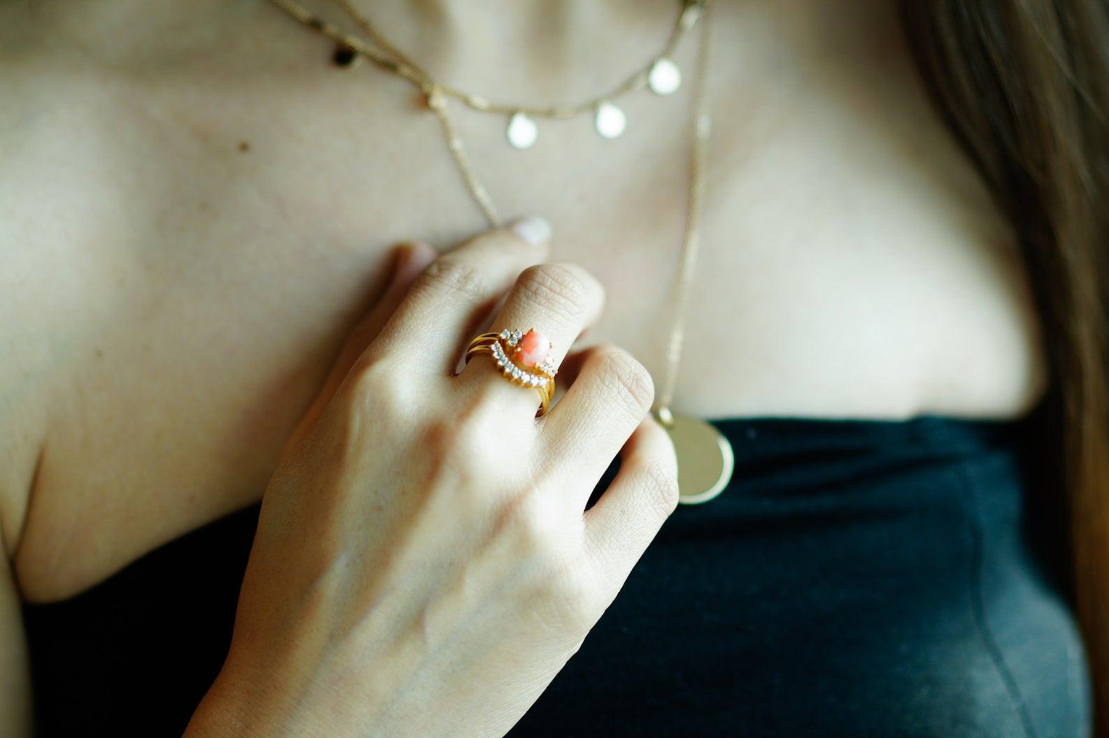 A beautiful diamond gold ring with a big pink coral as its center. It’s perfect for an anniversary gift, birthday gift, or as an engagement ring for your wedding.

This lovely pink coral ring is made using one big pink coral as its center. It is