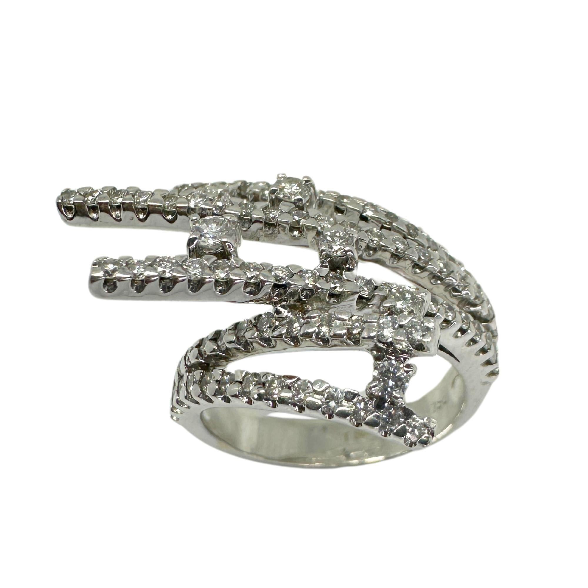 Indulge in timeless elegance with our 18K Diamond Ring. Crafted in 18k white gold, this ring boasts a stunning 1.03 carat diamond. In good condition with a weight of 7.5 grams, it adds a touch of luxury to any outfit. Perfect for a size 6.25