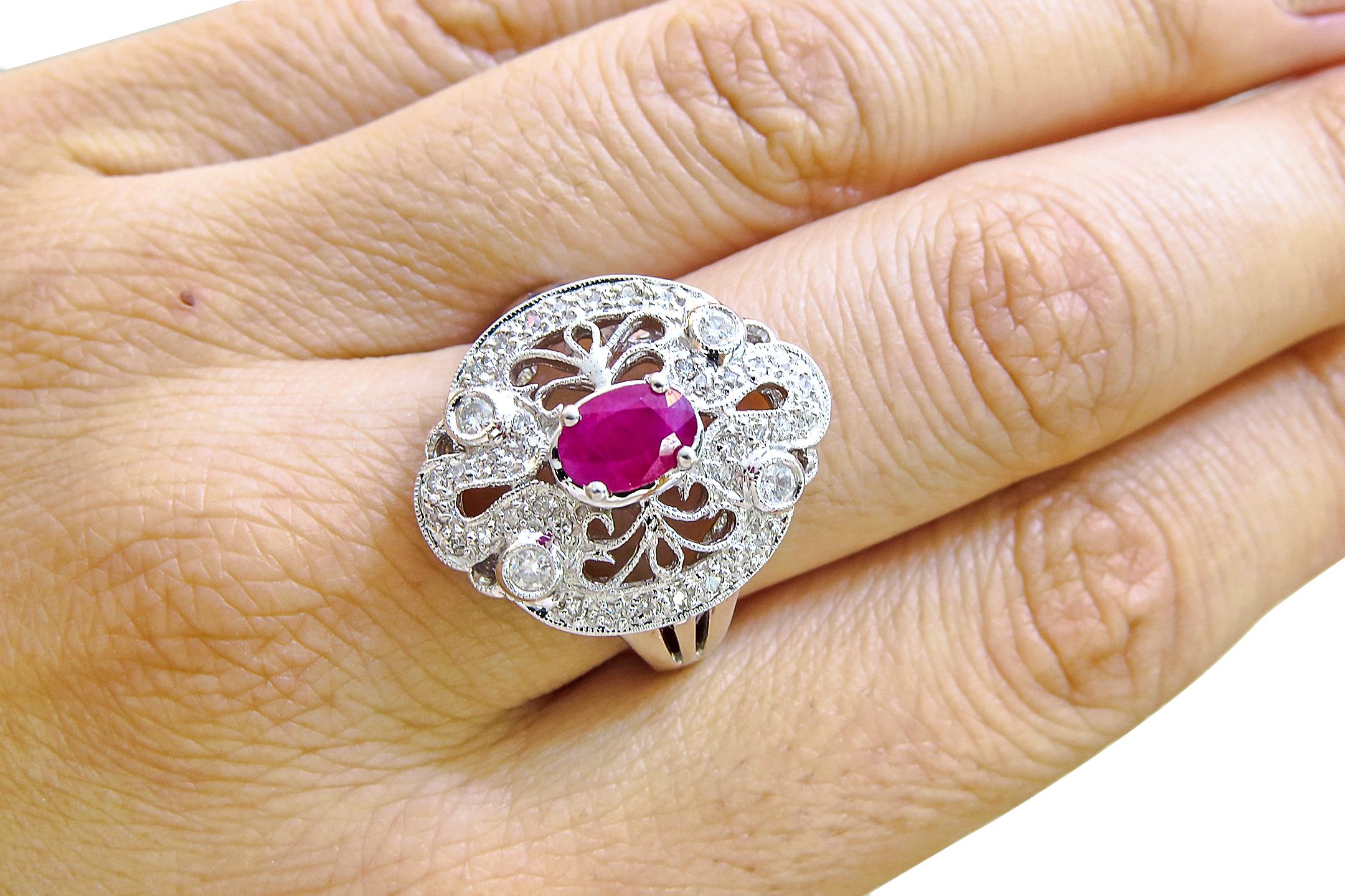 18K White Gold 
Weight= 9.1 gr 
Size= 7 
Diamond= 0.60 Ct total 
Ruby= 0.75 Ct total 
Year= 1990