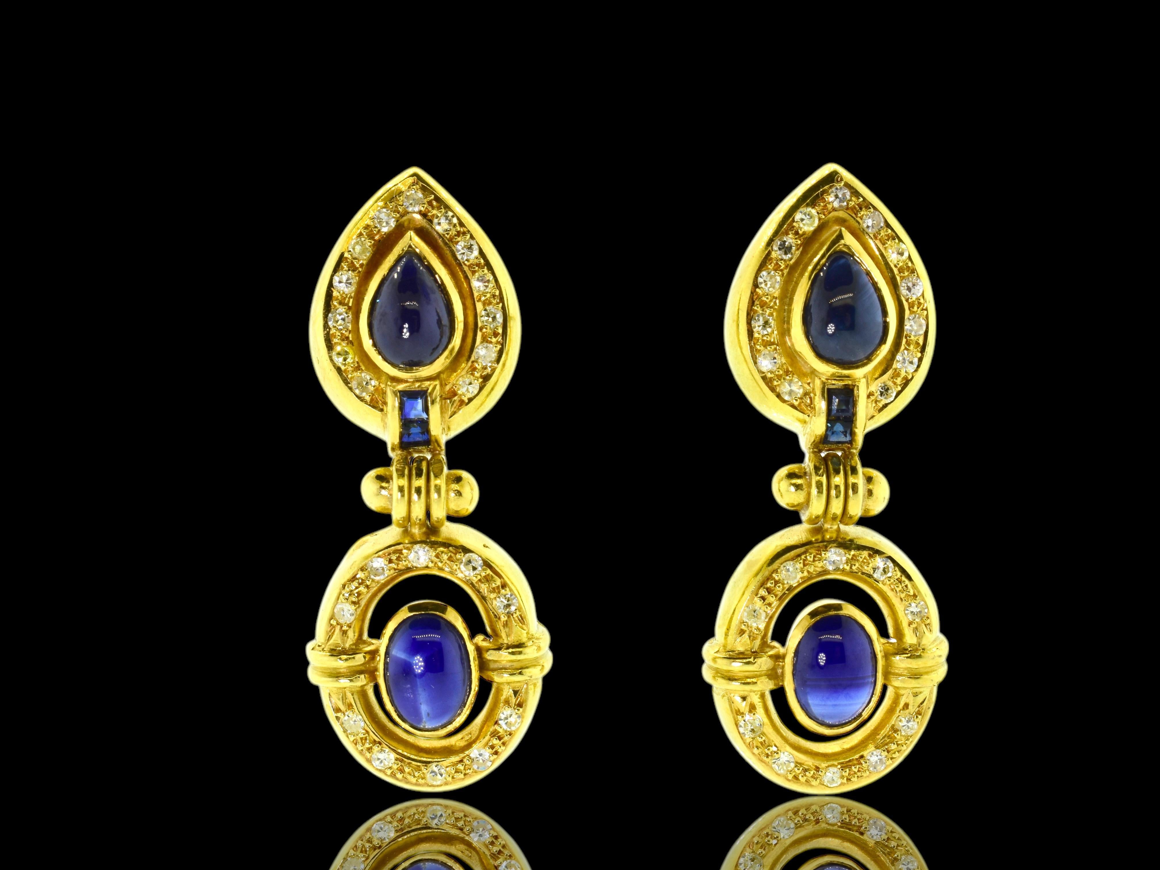 18K Yellow gold earrings with pear and oval cut natural sapphires accented with white brilliant cut diamonds. These earrings weigh 13.3 grams, each earring possess 2 pearcut and 2 oval natural deep blue sapphires as well as 2 square cut matching