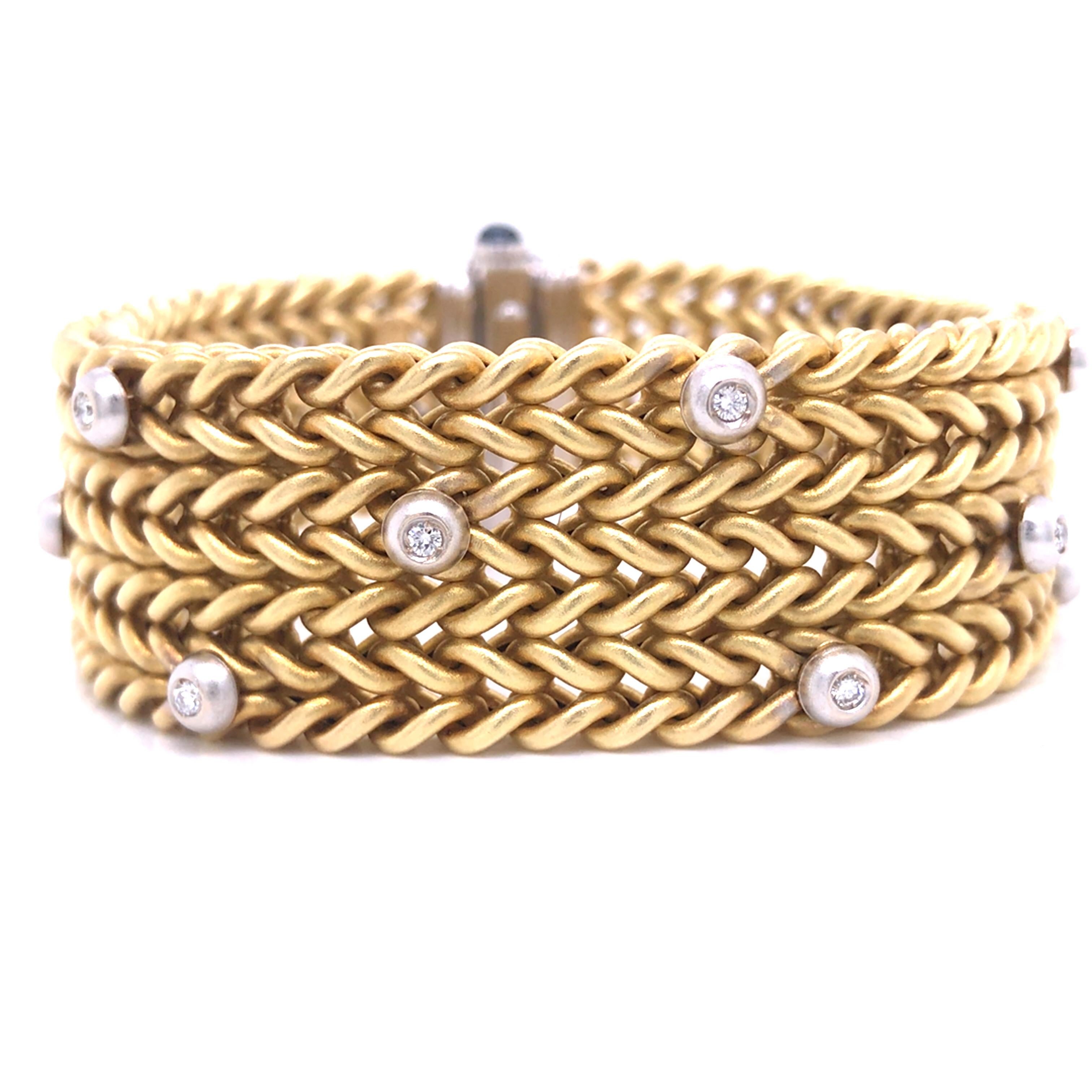 Diamond Sapphire Woven Bracelet in 18K Two-Tone Gold.  (2) Sapphires weighing 0.50 carats and Round Brilliant Cut Diamonds weighing 0.80 carat total weight, G-H iin color VS-SI in clarity.  The Bracelet measures 7 3/4 inch in length and 1 1/8 inch