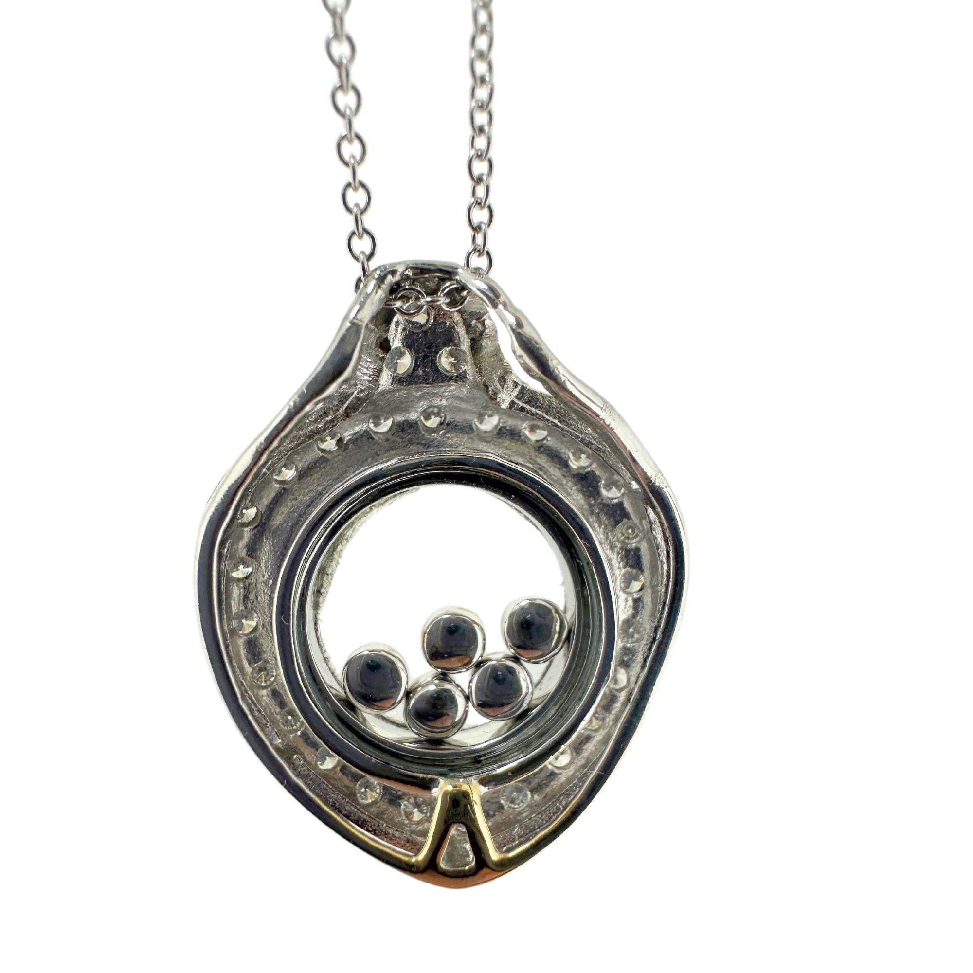 Upgrade your style with our 18k Diamond Shaker Locket Pendant Necklace. The 0.25 carats of diamonds are showcased in a unique 0.80 by 0.60 inch pendant. The 18 inch chain is adjustable to 15.5 inches. In good condition with minor surface wear, this