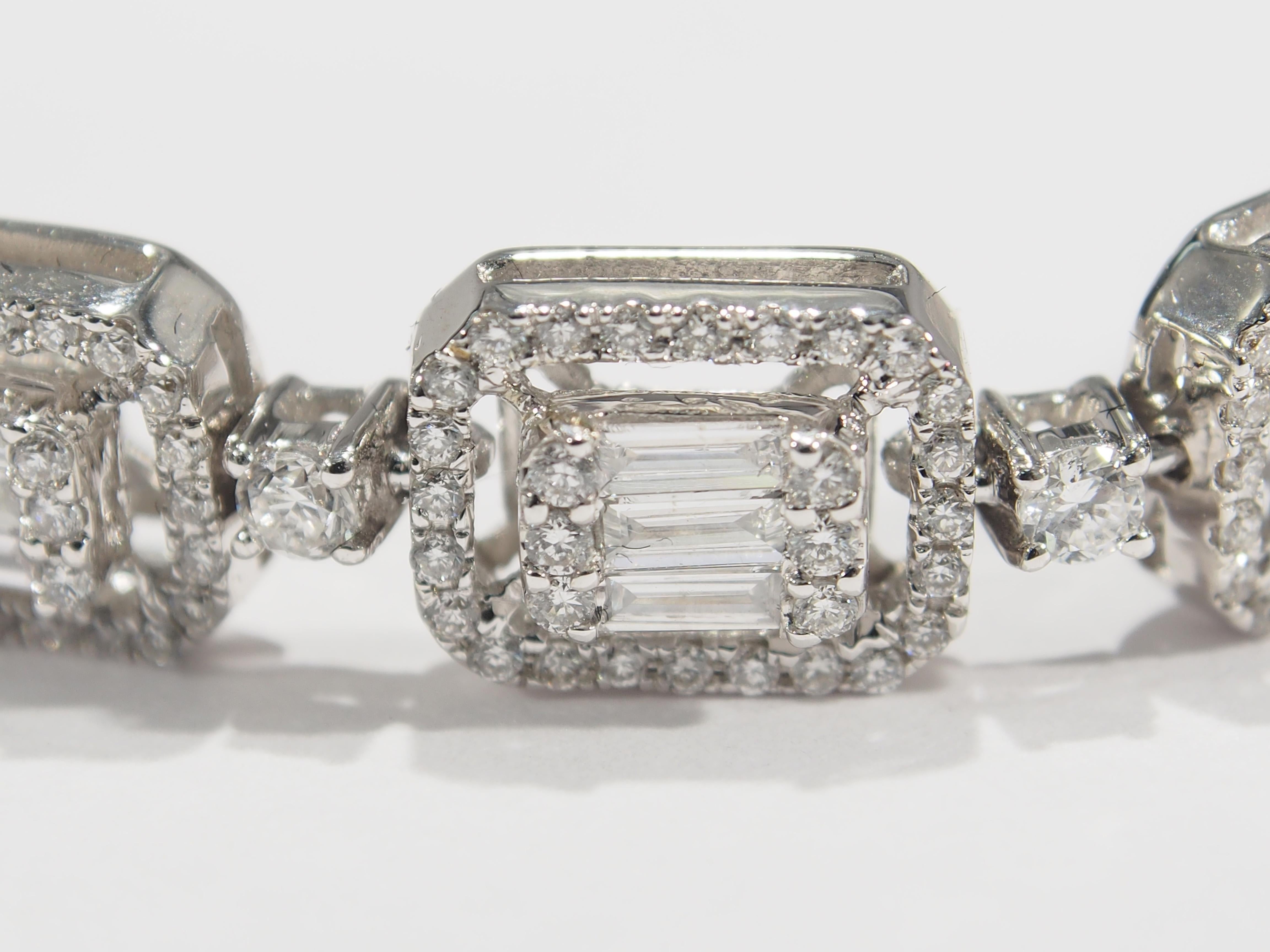 A beautiful bracelet set with 434 Round Brilliant Cut Diamonds 42 Baguette Diamonds G-H in color VS-SI, in clarity and approximately 4.08 total weight. Expertly set in 18K white gold weighing 19.69 grams. 7 inches long, approximately 1/4 inch wide.