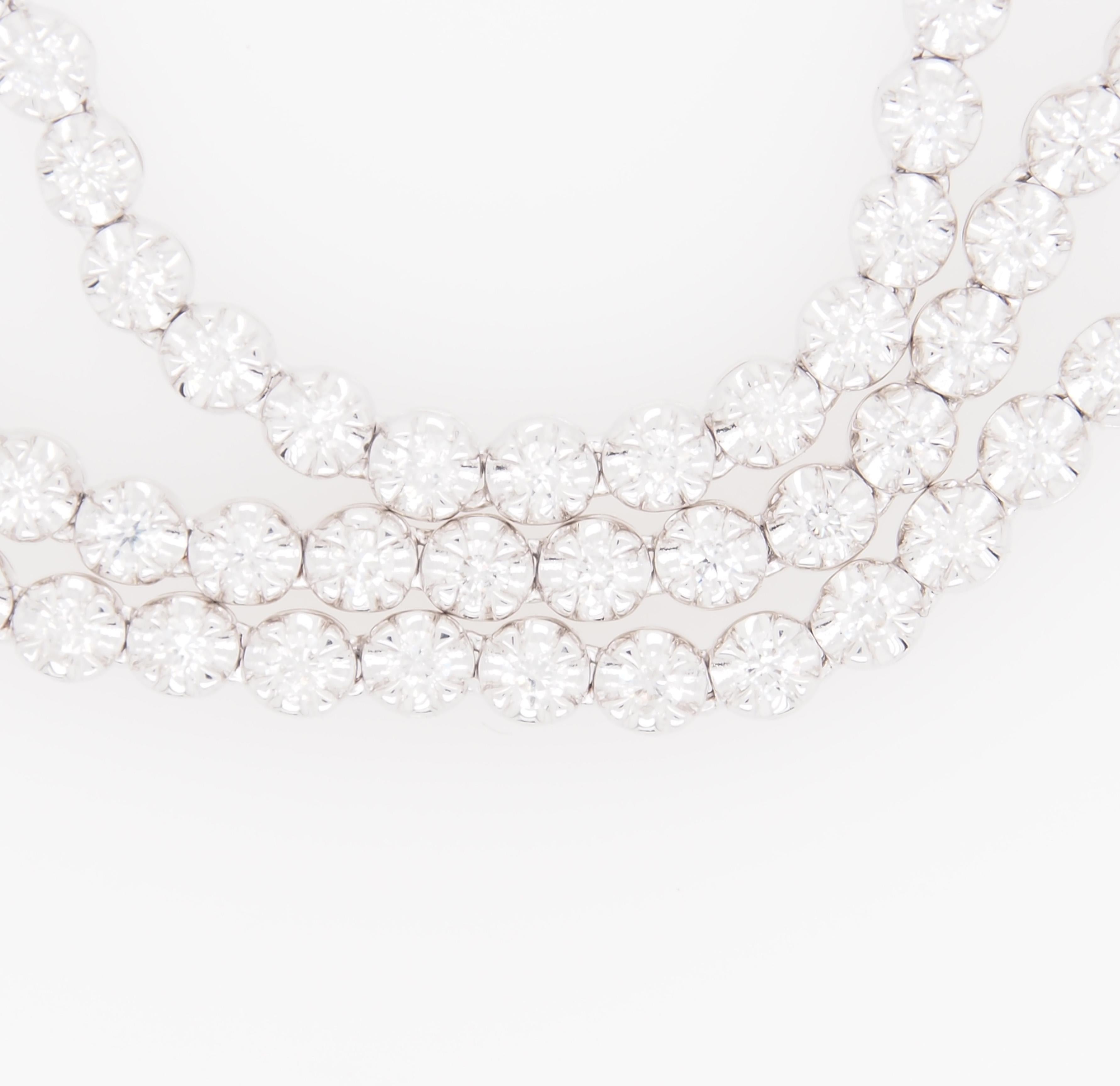 This is a stunning 18K White Gold Tennis Necklace with 303 Sparkling Round Brilliant Cut Diamonds, approximately 6.02ctw, G-H in Color, VS-SI in Clarity. The Necklace is a versatile 34 inches in length allowing one to wear it one length or doubled.
