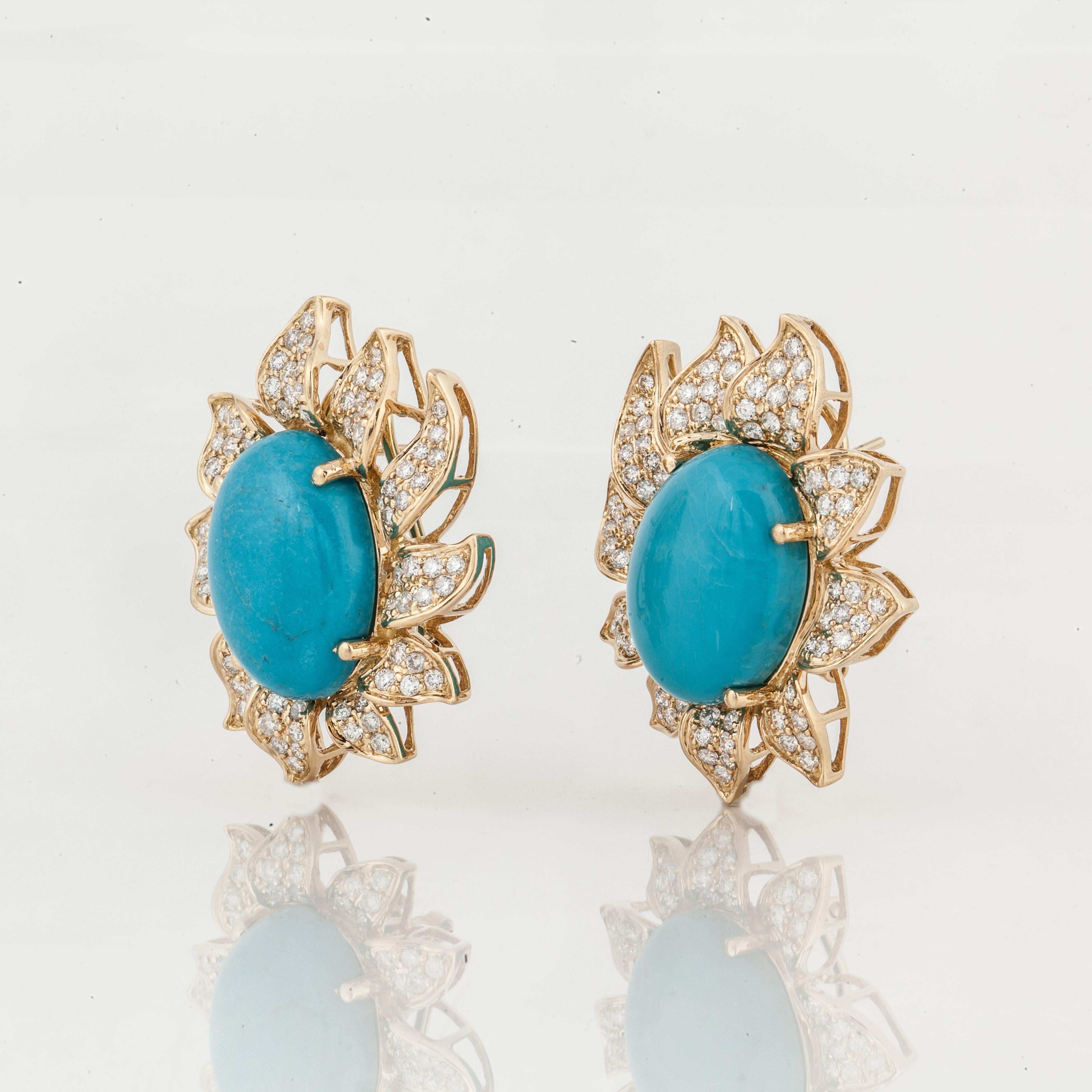 18K yellow gold earrings featuring oval turquoise stones accented by pavé round diamonds.  There are 154 round diamonds totaling 4 carats; G-H color and VS-SI clarity.  Measure 1 5/8 inches by 1 1/4 inches.  For pierced ears with omega backs.