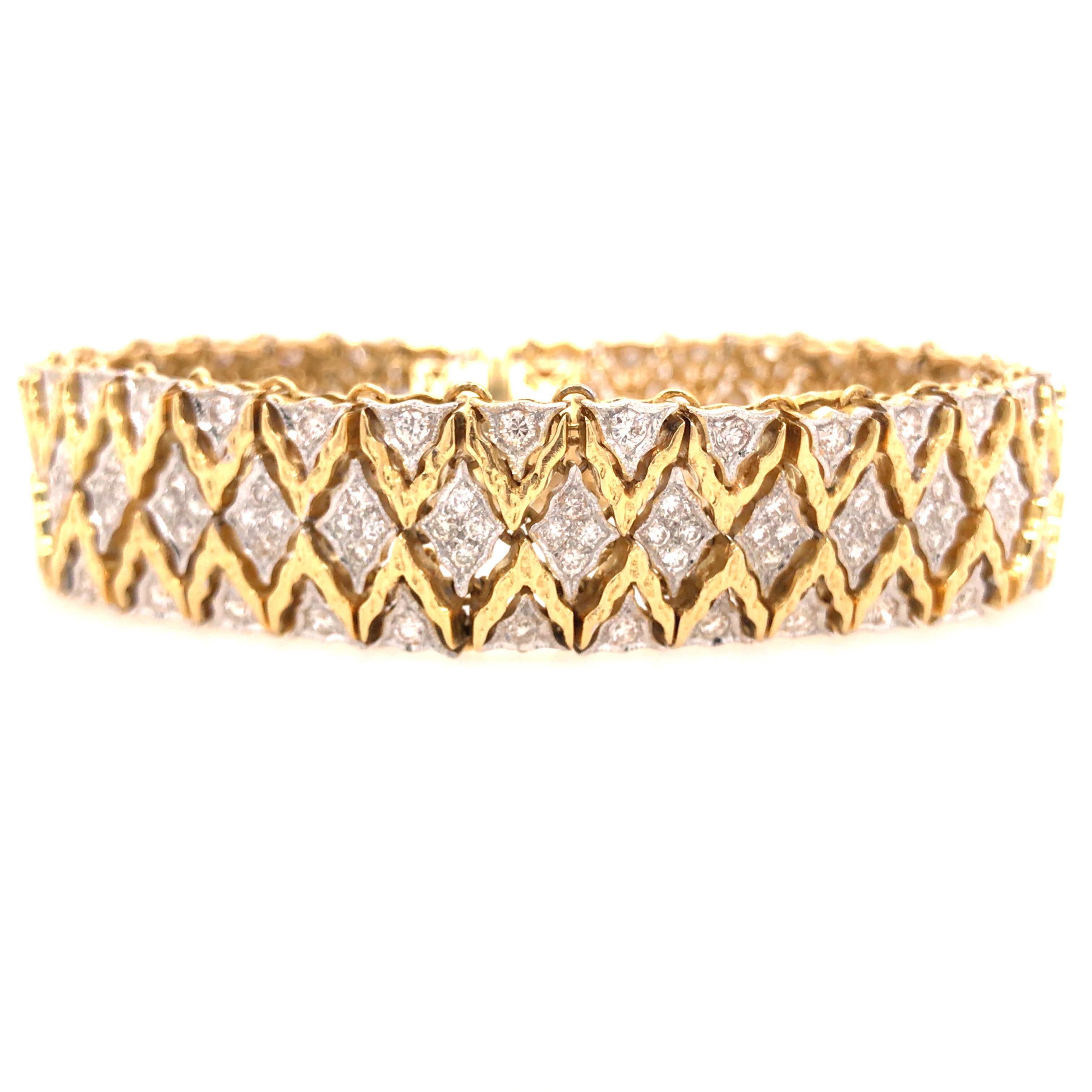 Diamond Weave Bracelet in 18K Two-Tone Gold.  The flexible woven Bracelet is expertly set with Round Brilliant Cut Diamonds weighing 5.03 carat total weight, G-H in color and VS-SI in clarity.  The Bracelet measures 7 inch in length and 5/8 inch in