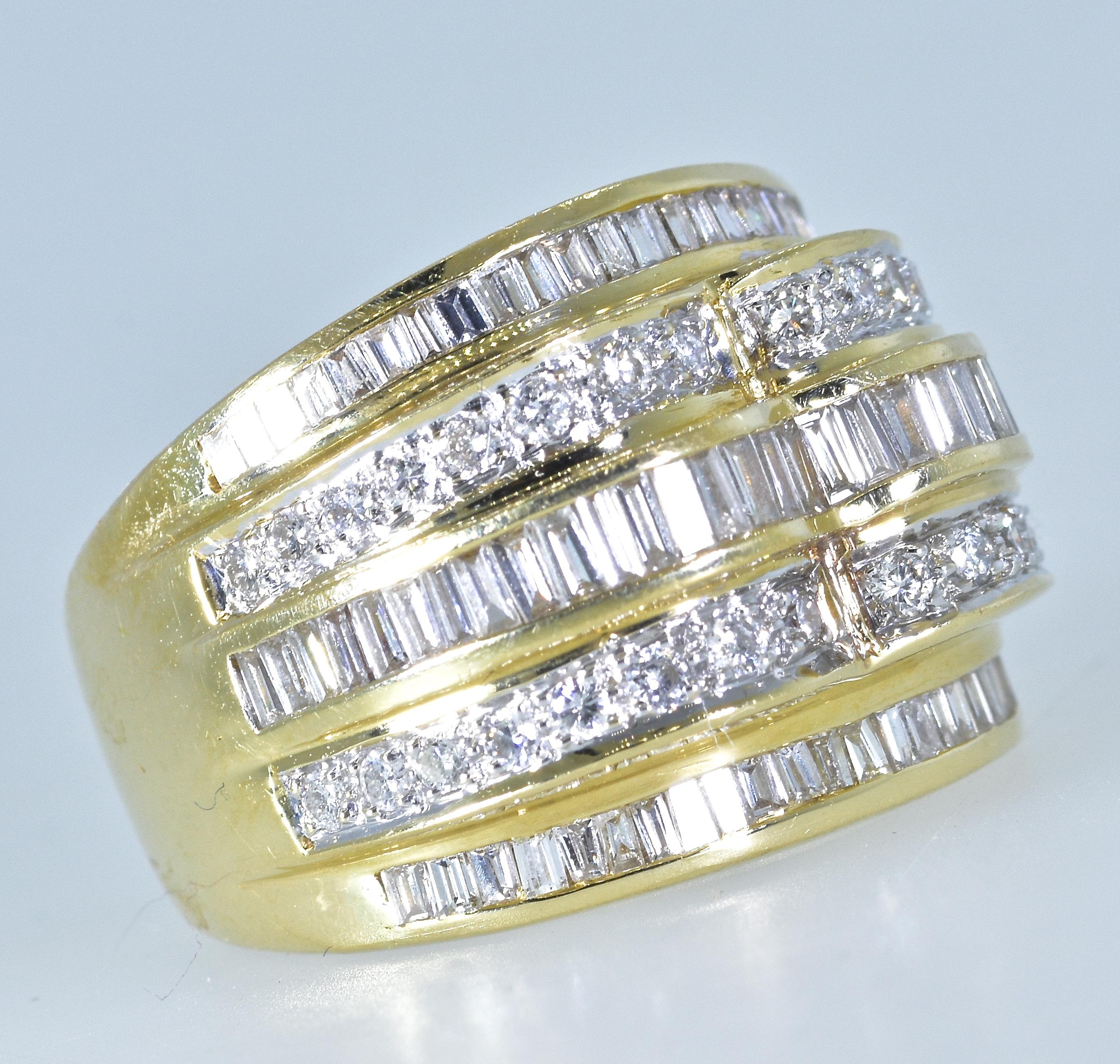 Diamond ring in 18K yellow gold, there are slightly graduating round brilliant cut  and baguette (both tapered and straight baguettes) cut diamonds set in this well made 18K ring.  All of these diamonds are near colorless (H/I) and slightly
