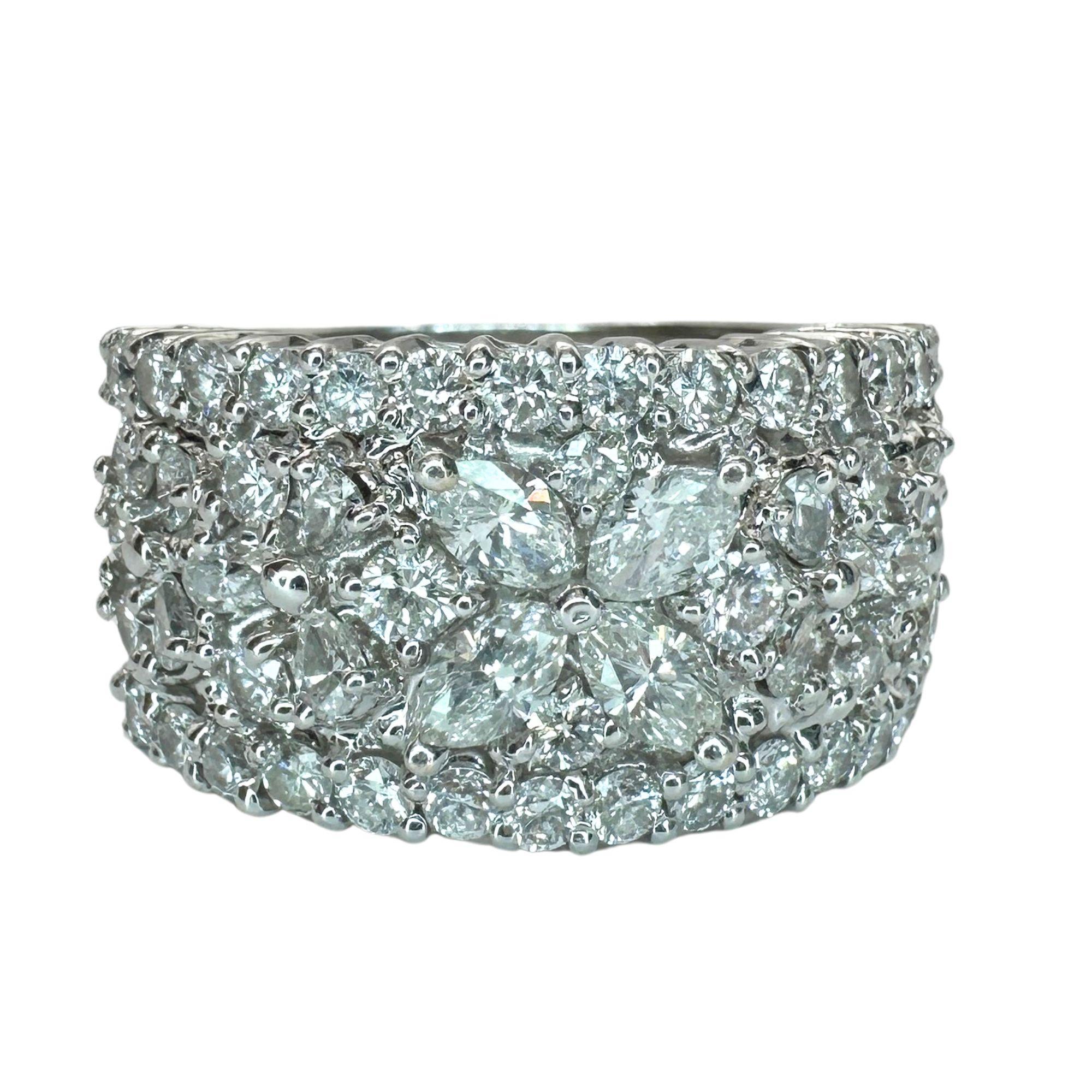 Elevate any outfit with this stunning 18k Diamond Wide Band Ring! Crafted in 18k White Gold, this ring features 2.45 carats of sparkling diamonds, creating a dazzling display. With a ring size of 7 and a width of 12.68mm, it's the perfect statement