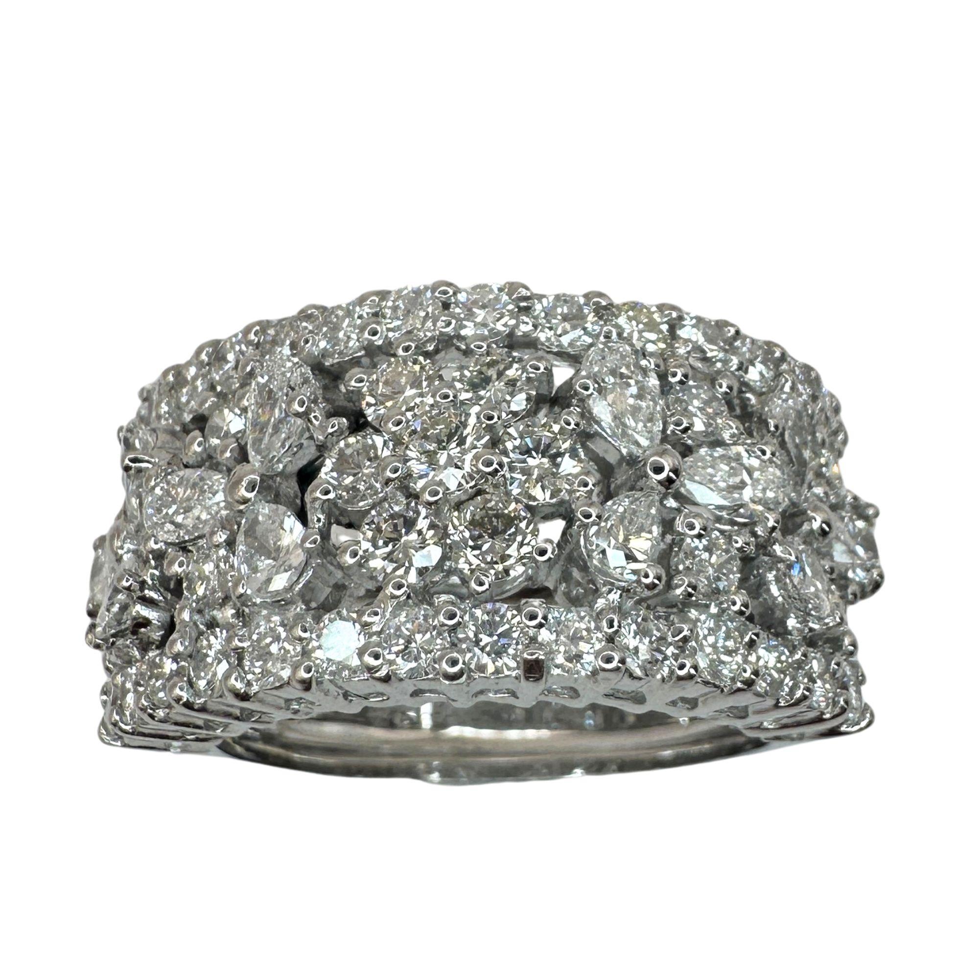 Experience luxury and elegance with our 18k Diamond Wide Band Ring. Featuring 2.21 carats of sparkling round and pear shaped diamonds, this ring is perfect for adding an extra detail any outfit. Made with 18k white gold, it's in good condition with
