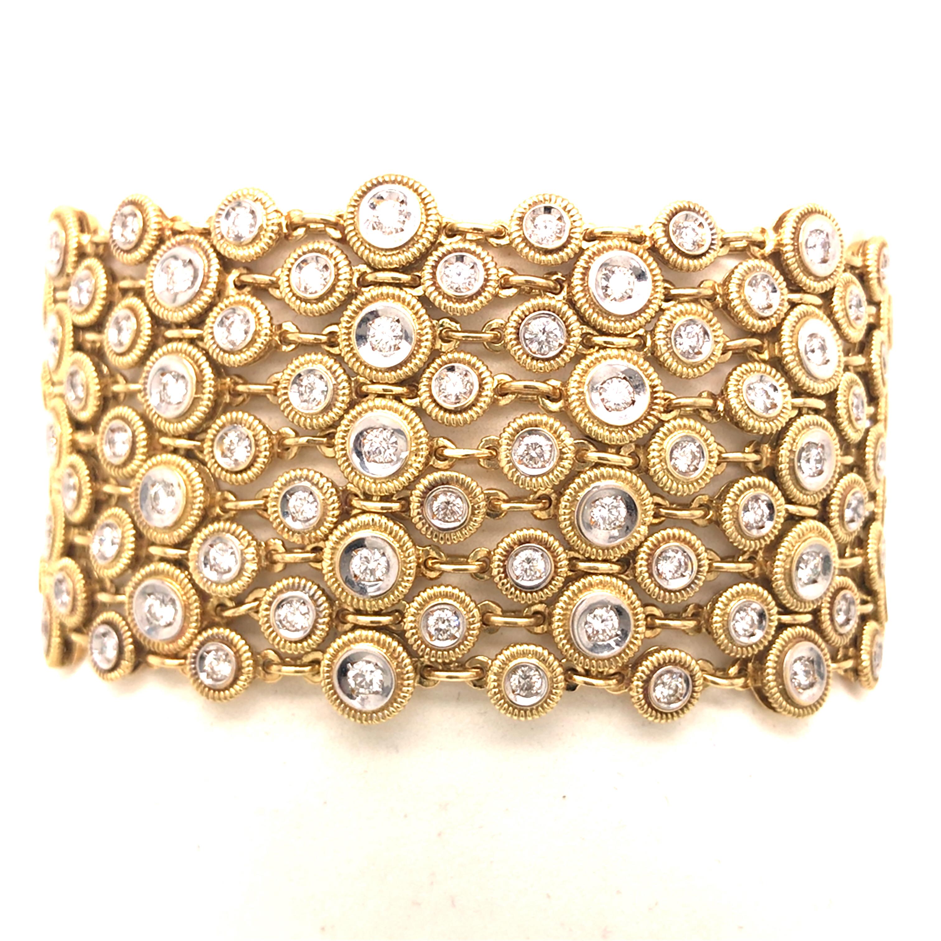 Diamond Wide Geometric Weave Bracelet in 18K Two-Tone Gold.  Round Brilliant Cut Diamonds weighing 8.35 carat total weight, G-H in color and VS in clarity are expertly set.  The Bracelet measures 7 inch in length and 1 3/8 inch in width.  99.6