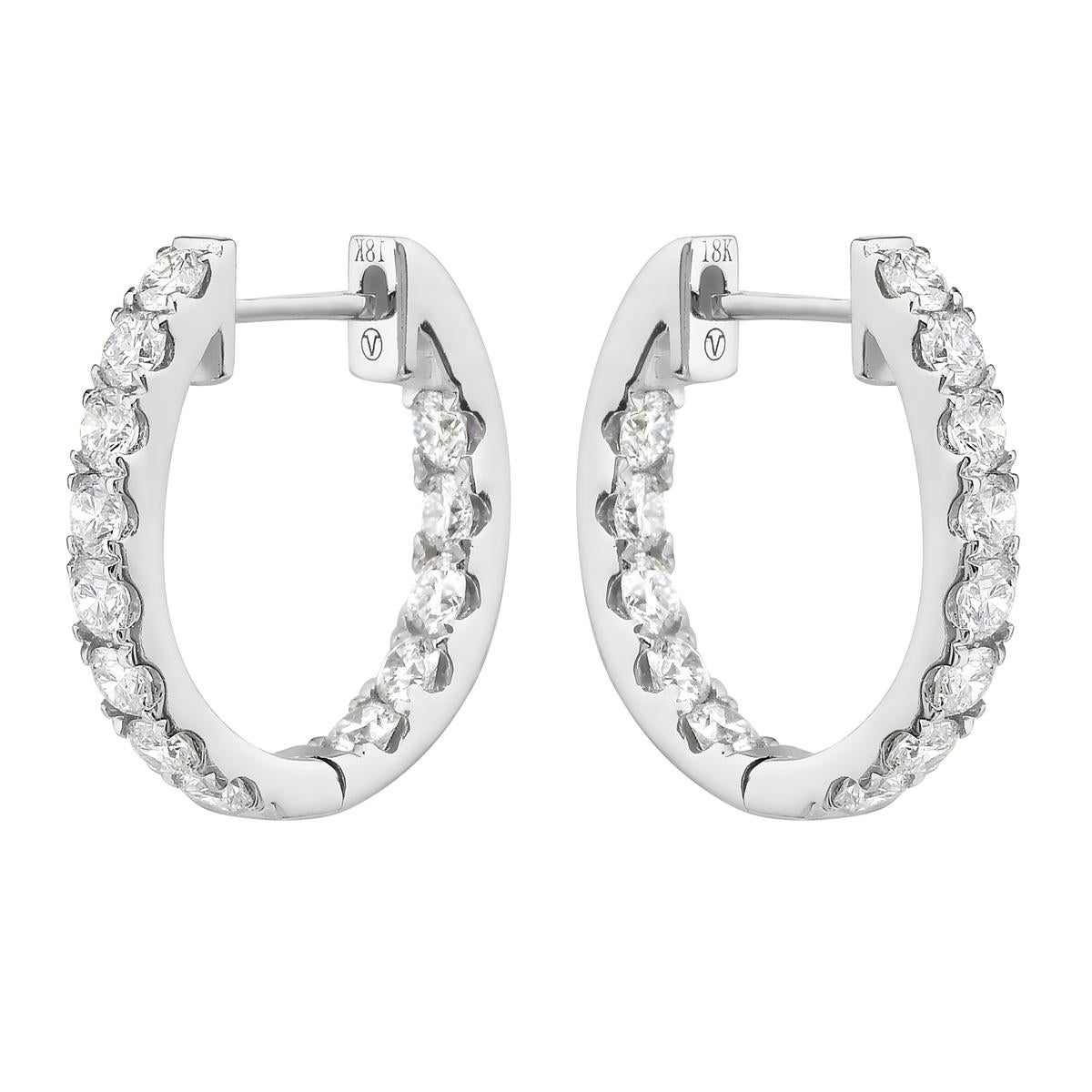 With these exquisite white gold inside and out hoop earrings, style and glamour are in the spotlight. These 18-karat earrings are made from 3.8 grams of gold. These earrings are adorned with VS2, G color diamonds, made out of 26 diamonds totaling