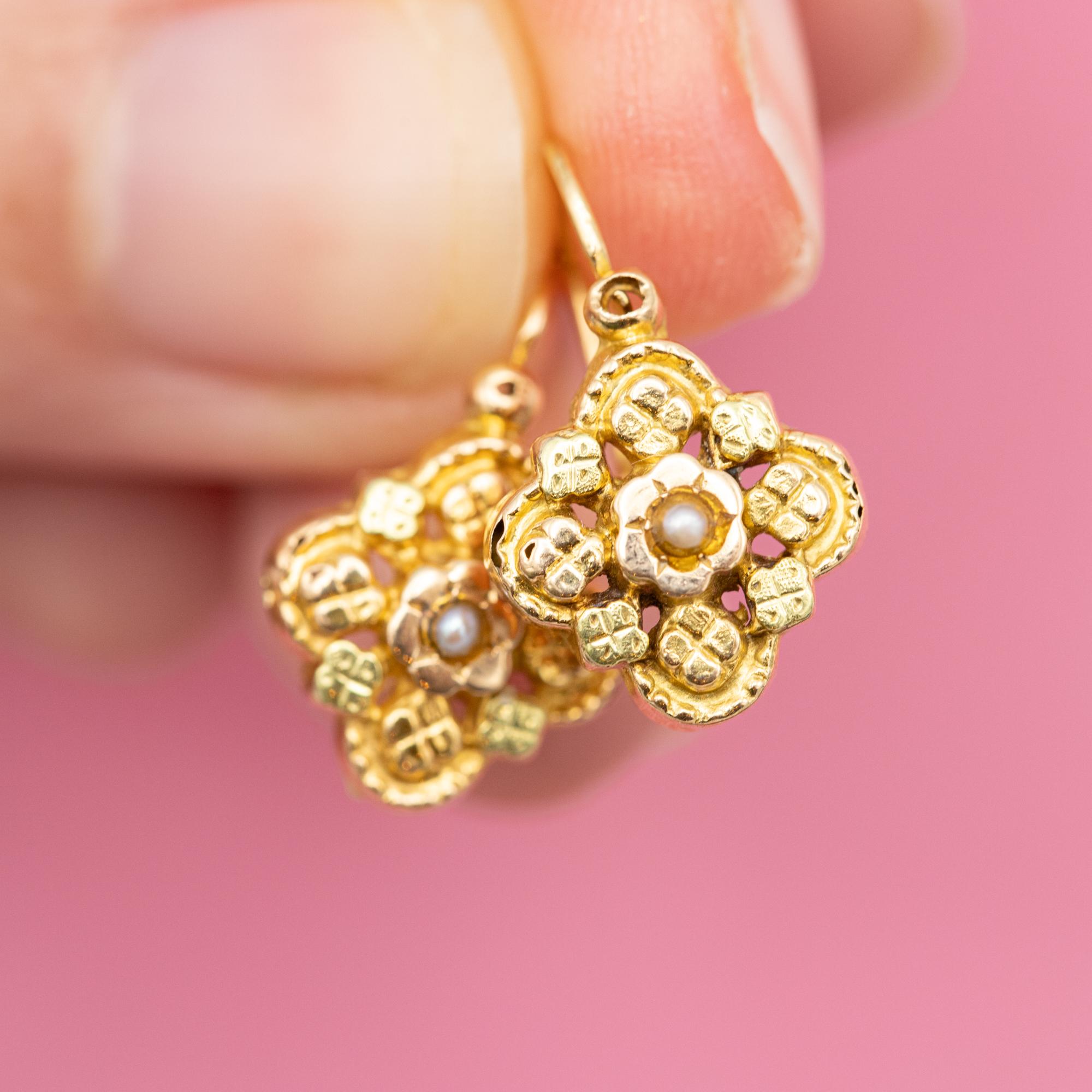 For sale are these cute French Napoleon III earrings. These 18 ct yellow gold dormeuse earrings (also called sleepers) have a front closure and are decorated with flower shaped ornaments, little seed pearls and finished with a lot of detail. The