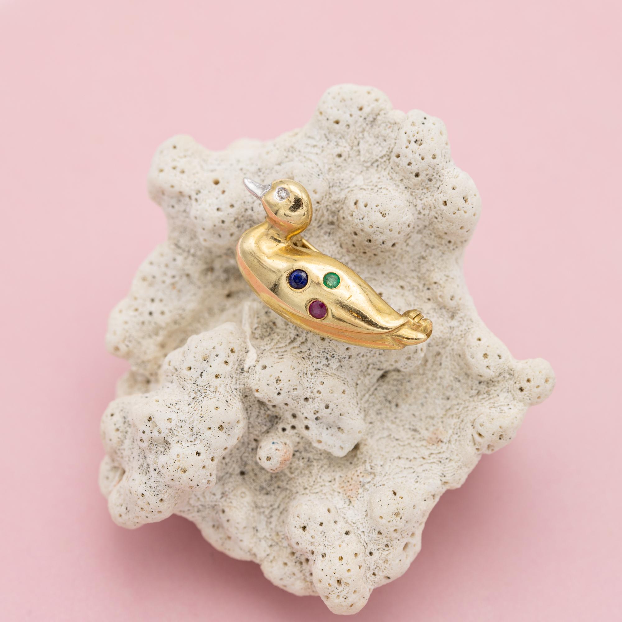 For sale is this very cute Belgian duck brooch. This 18k yellow gold animal is set with a single cut diamond eye and decorated with a sapphire, ruby and sapphire. It bears a Belgian 750 mark. The brooch is functioning and in very good condition