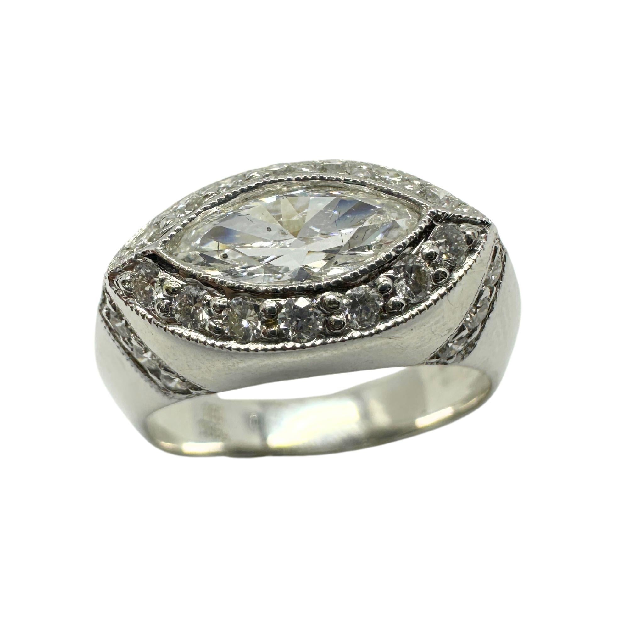 18k East-West Marquise Shaped Diamond Center Ring with Diamond Halo Ring
Condition: In good condition with some minor surface wear consistent with age.
Ring size: 6.25
Markings: “T864” 