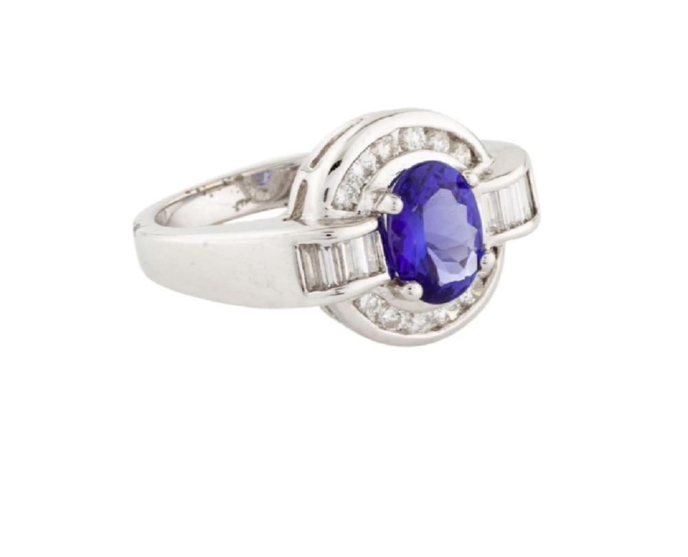 Beautiful 18K white gold ring with a blue tanzanite and baguette diamonds. The magnificent enhanced blue tanzanite in the captivating Baguette diamonds is superb.
*****
Details:
►Metal: White Gold
►Gold Purity: 18K
►Tanzanite Weight: Oval Modified