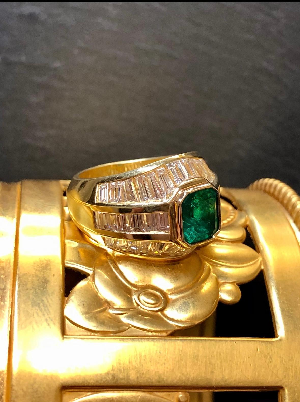 A classic statement ring done in 18K yellow gold centered by an approximately 1.20ct natural emerald surrounded by numerous baguette diamonds being G-J in color and Vs1-2 in clarity with a total approximate weight of 4cttw.

Dimensions/Weight 
.80”