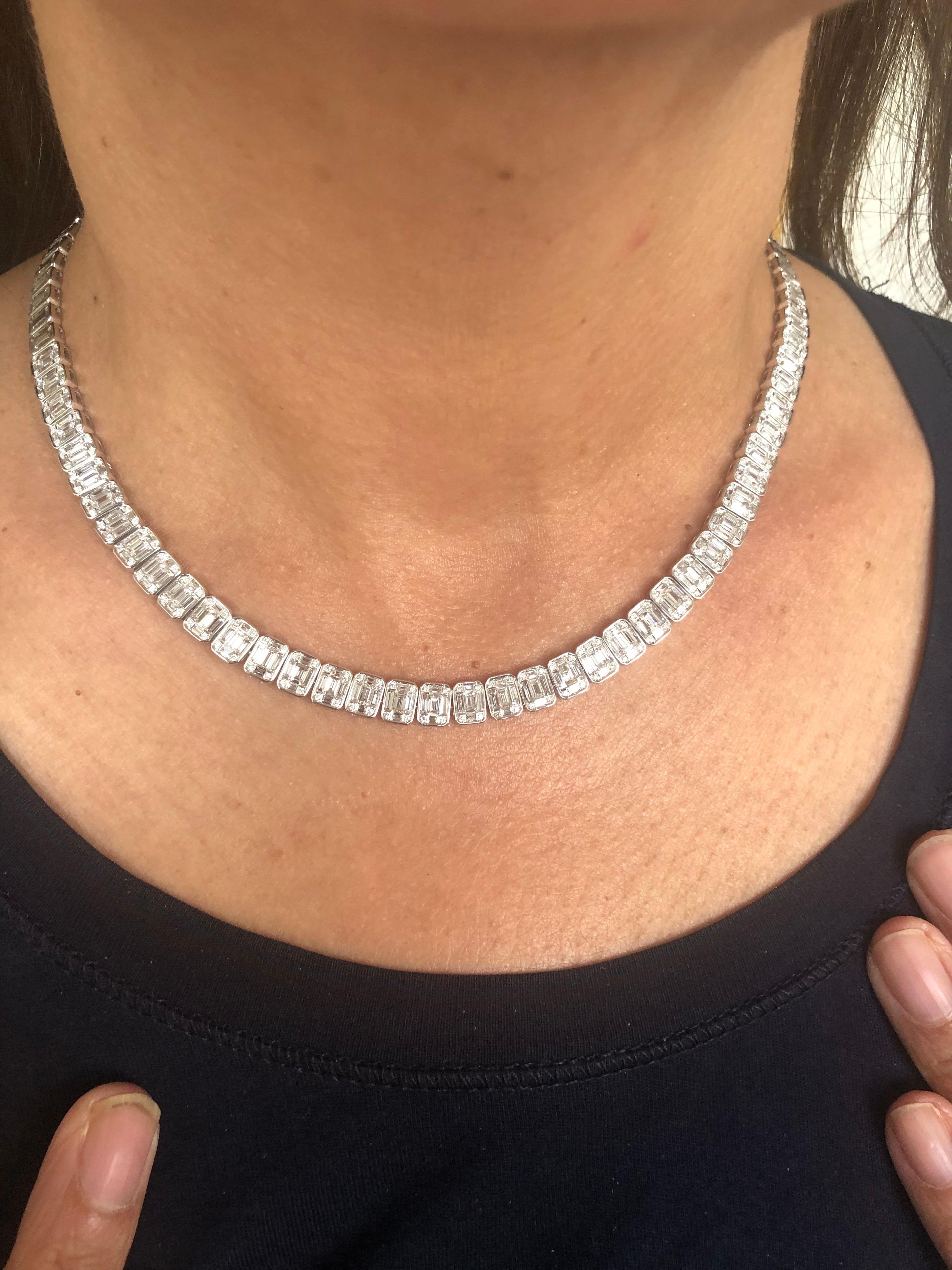 Baguette and Round diamonds set in an emerald cut illusion bezel setting. The necklace is set with diamonds halfway in 18K white gold. The total carat weight of the piece is 8.86 carats. The color of the stones are F, and the clarity is VS1-VS2. The
