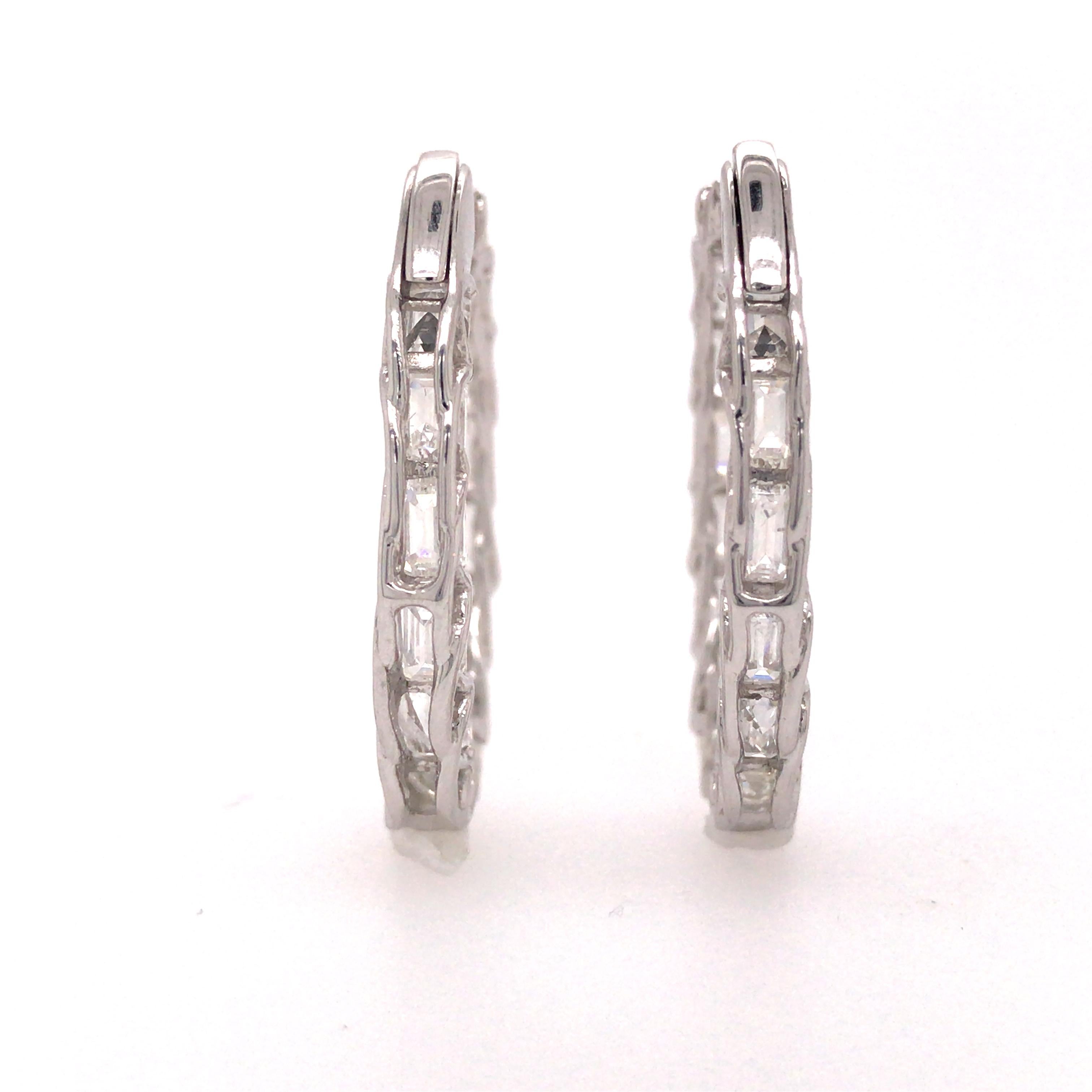 Emerald Diamond Elongated In/Out Hoop Earrings in 18K White Gold.  Emerald Cut Diamonds weighing 5.89 carat total weight, G-H in color and VS in clarity are expertly set.  The Earrings measure 1 1/8 inch in length and 1 inch in width.  8.10 grams.