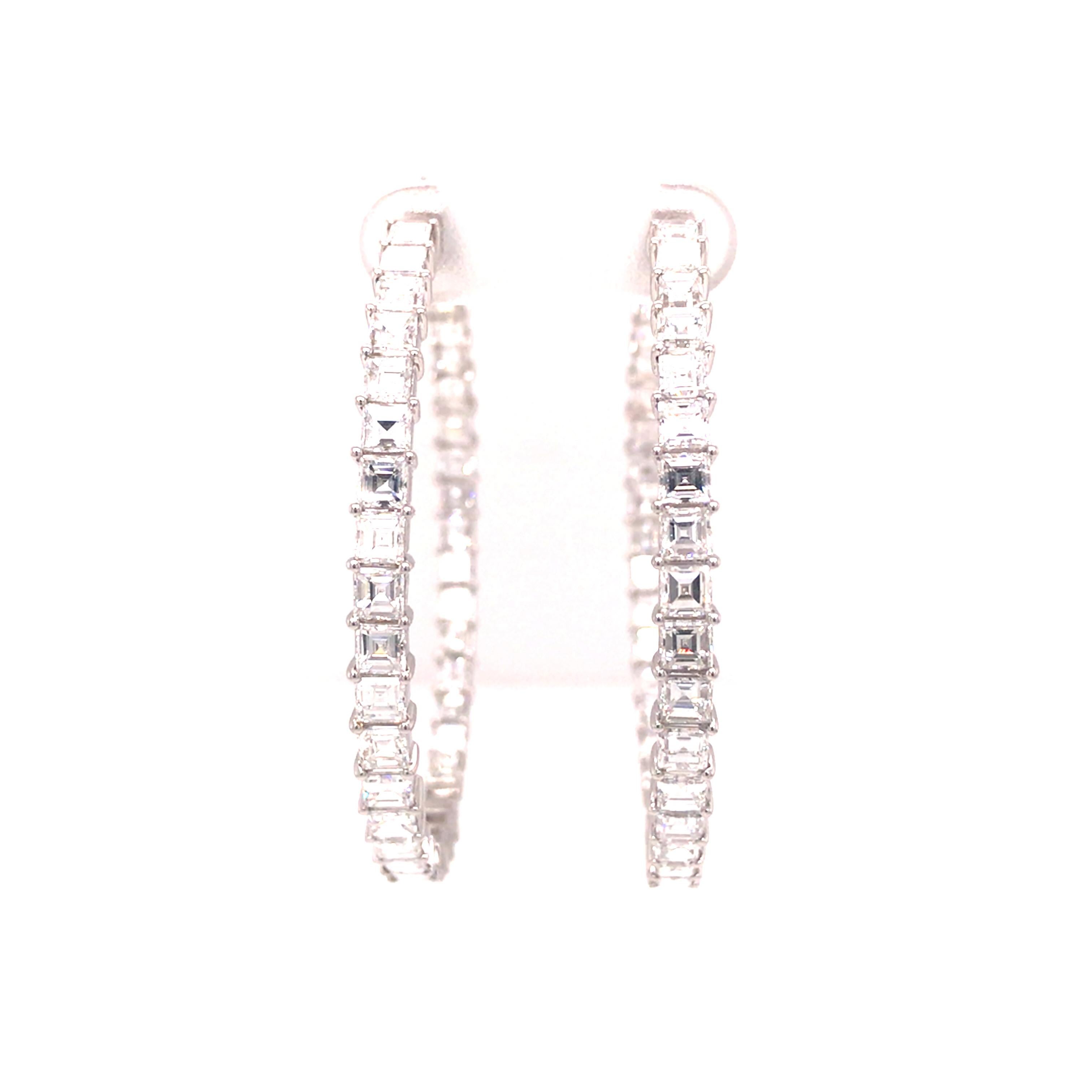 Emerald Diamond In/Out Hoop Earrings in 18K White Gold.  (58) Emerald Cut Diamonds weighing 6.75 carat total weight, G-H in color and VS-SI in clarity are expertly set.  The Earrings measure approximately 2 inch in length and 1/4 inch in width.