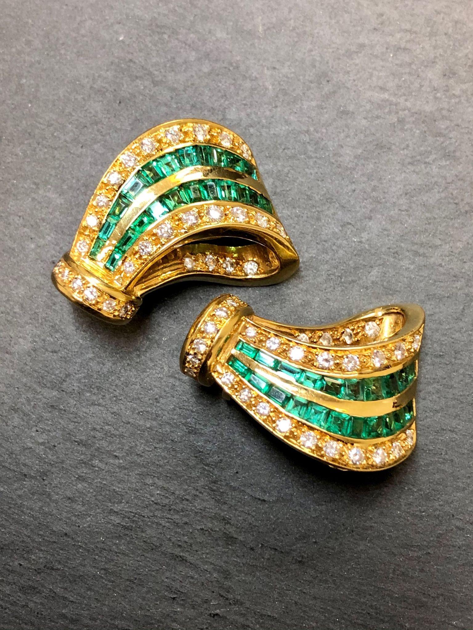 A unique pair of handmade earrings done in 18K yellow gold and set with approximately 1.60cttw in G-H color Vs1-Si1 clarity diamonds as well as approximately 4.50cttw in amazing, minty green and eye-clean natural square