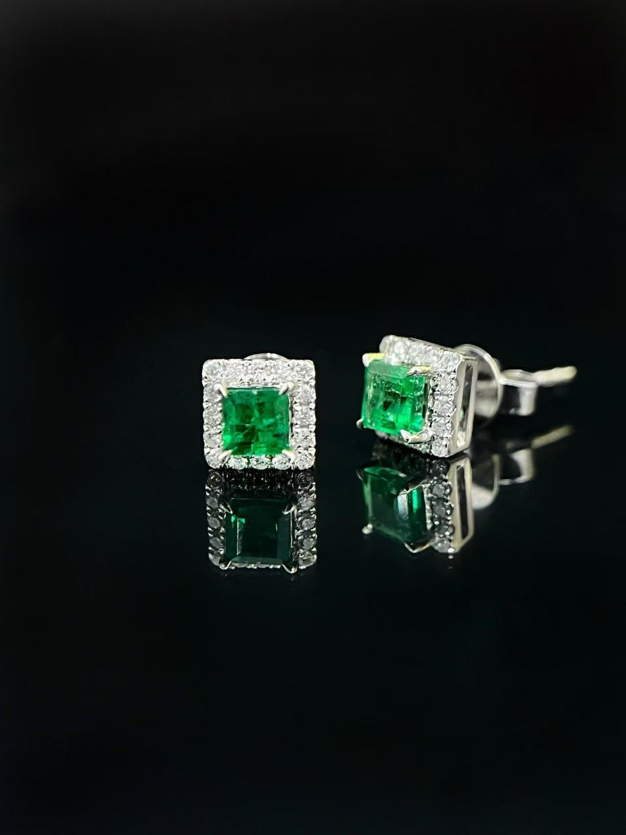 Modern 18K Emerald Stud Earrings with Halo of Diamonds For Sale