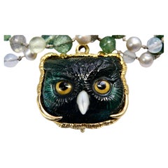18k enhancer with carved green Tourmaline Owl head