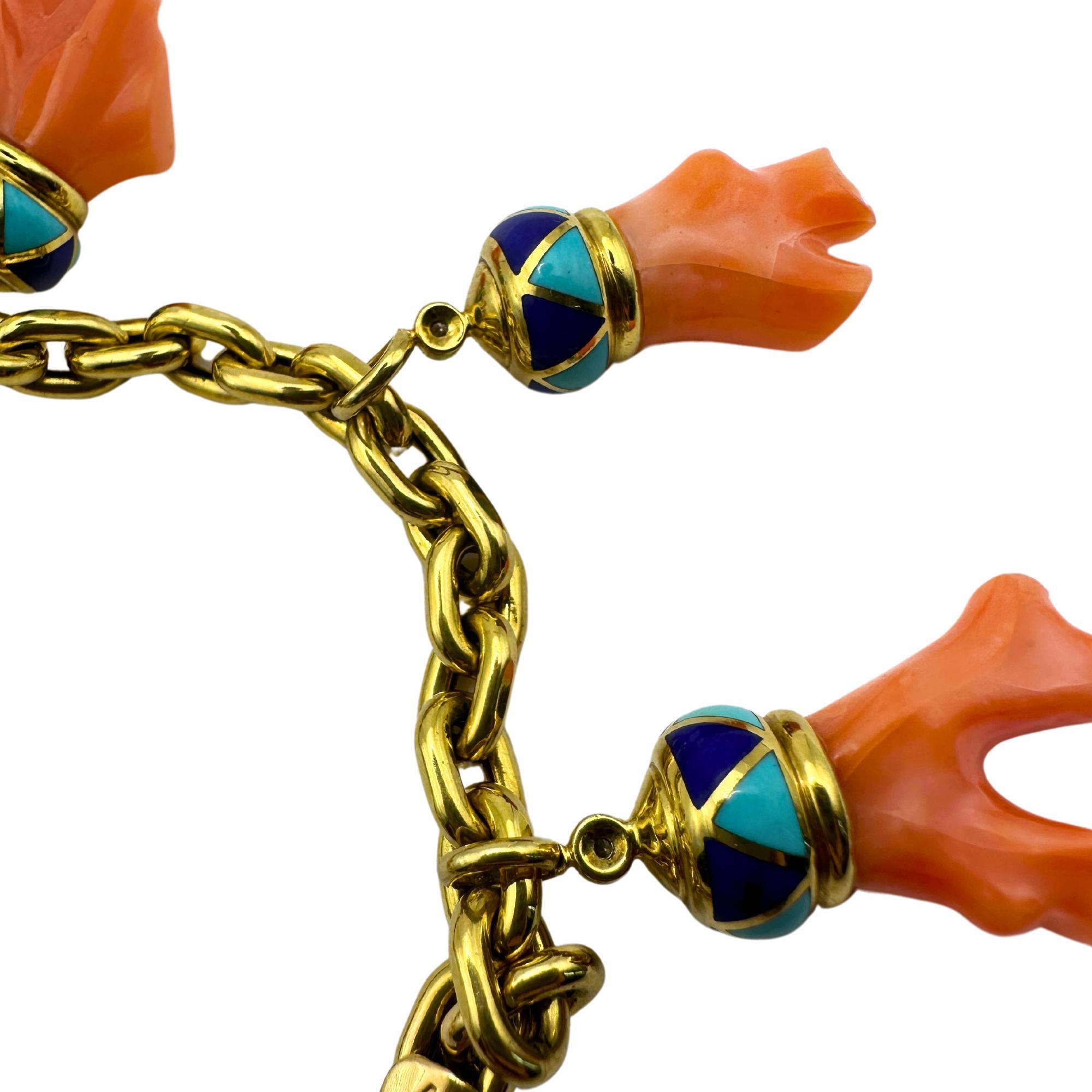 Add a touch of vintage charm to your jewelry collection with this stunning 18K Estate Enamel and Coral Charm Bracelet! Made from luxurious 18k yellow gold, the bracelet features bright and bold enamel details as well as beautiful coral accents. In