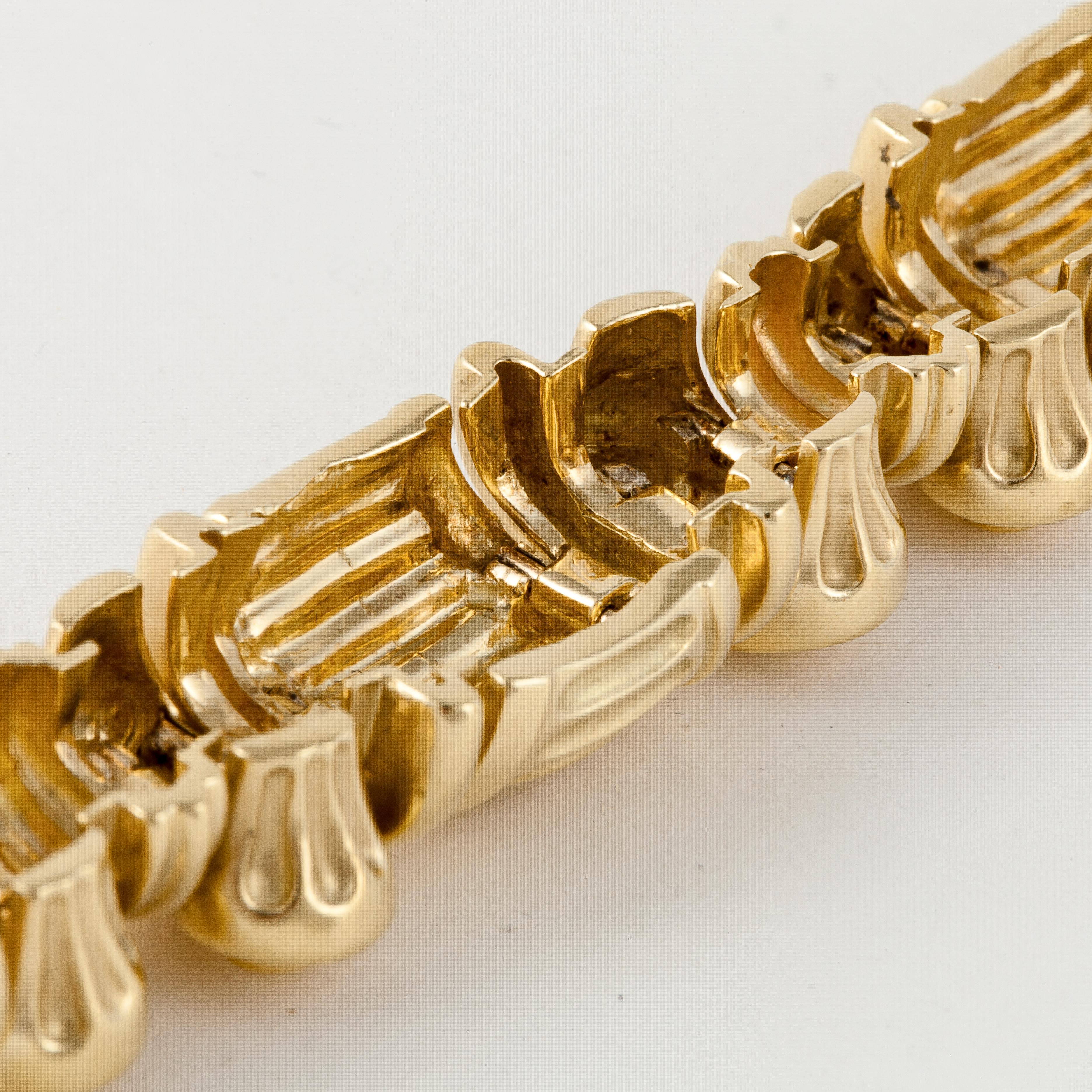 Esti Frederica 18K yellow gold bracelet.  Links are Roman/Greek inspired and resemble columns with scrolling in between.  Measures 8 1/8 inches long and 11/16 inches wide.  Tongue closure with underneath safety.  Matching necklace and earrings in