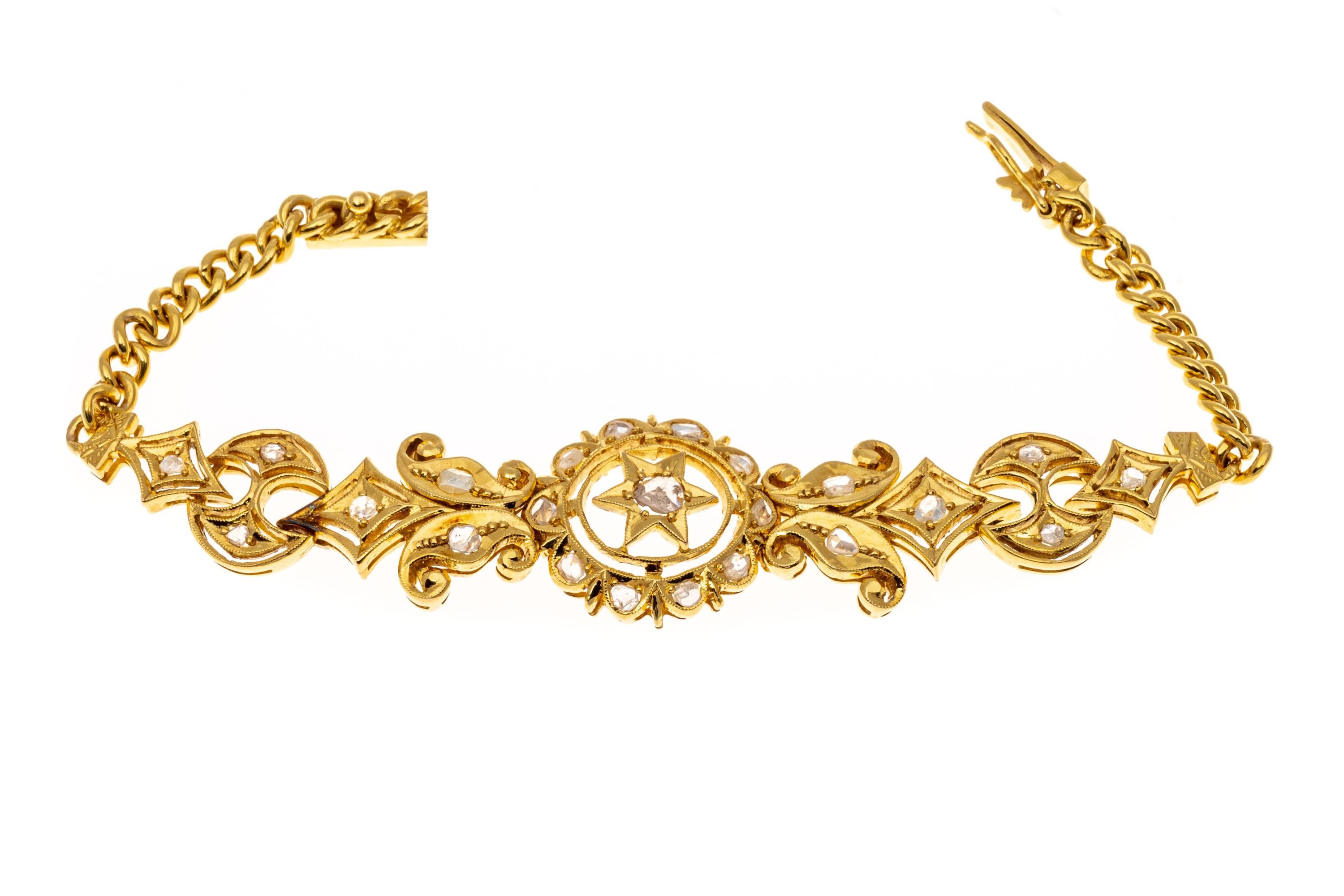 18k yellow gold bracelet. This eye-catching bracelet is a plaque style, with a diamond cut filigree placque set with macle cut diamonds. The plaque is held by a curb link style chain, which has a hidden box style clasp with a figure eight