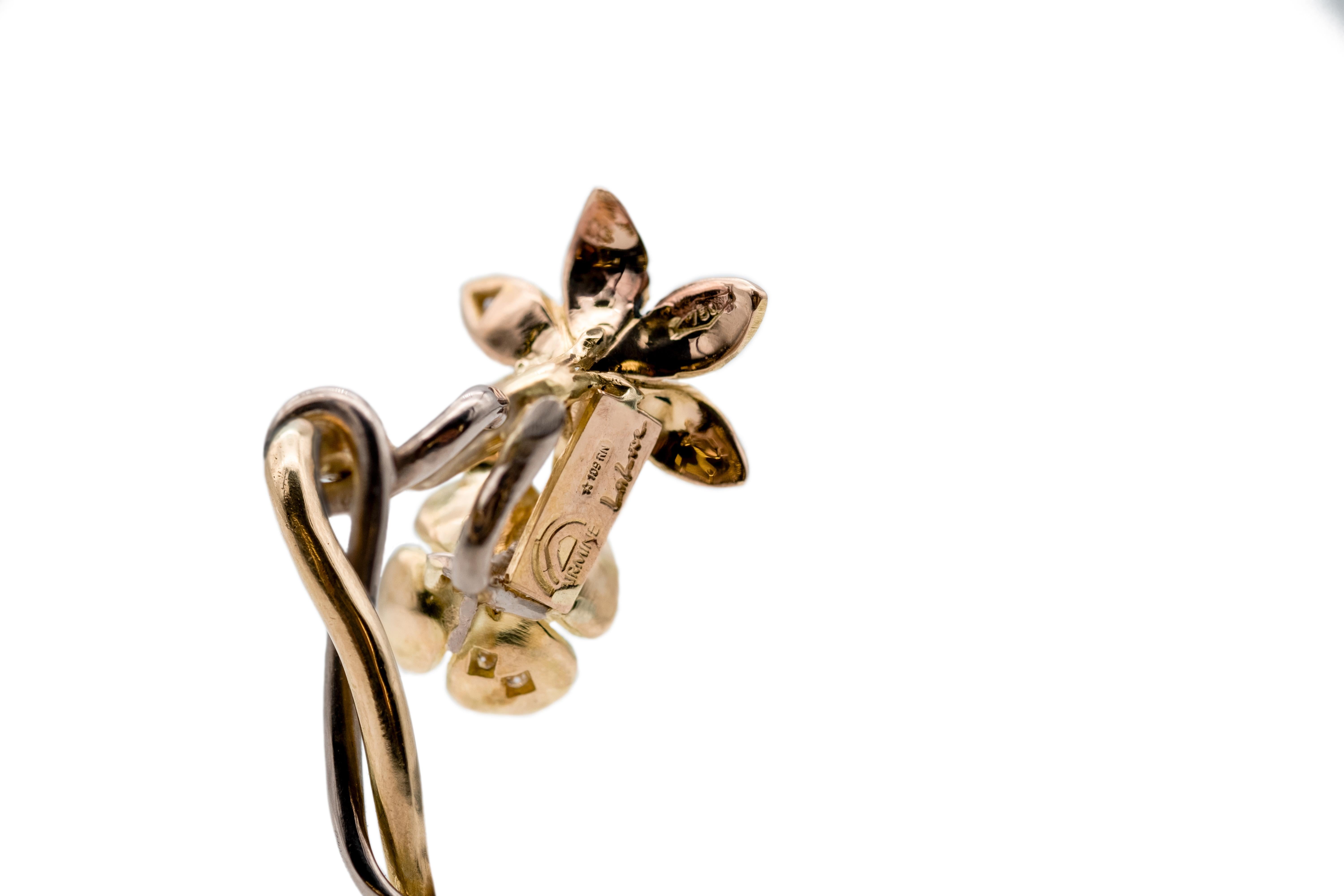 Completely handmade in Italy, 18K yellow, rose and palladium white Fairmined Gold earring with Canadamark diamonds.

The flowers screw into the stem. The screw is handmade, we suggest closing it gently and being careful not to force it. 

This item