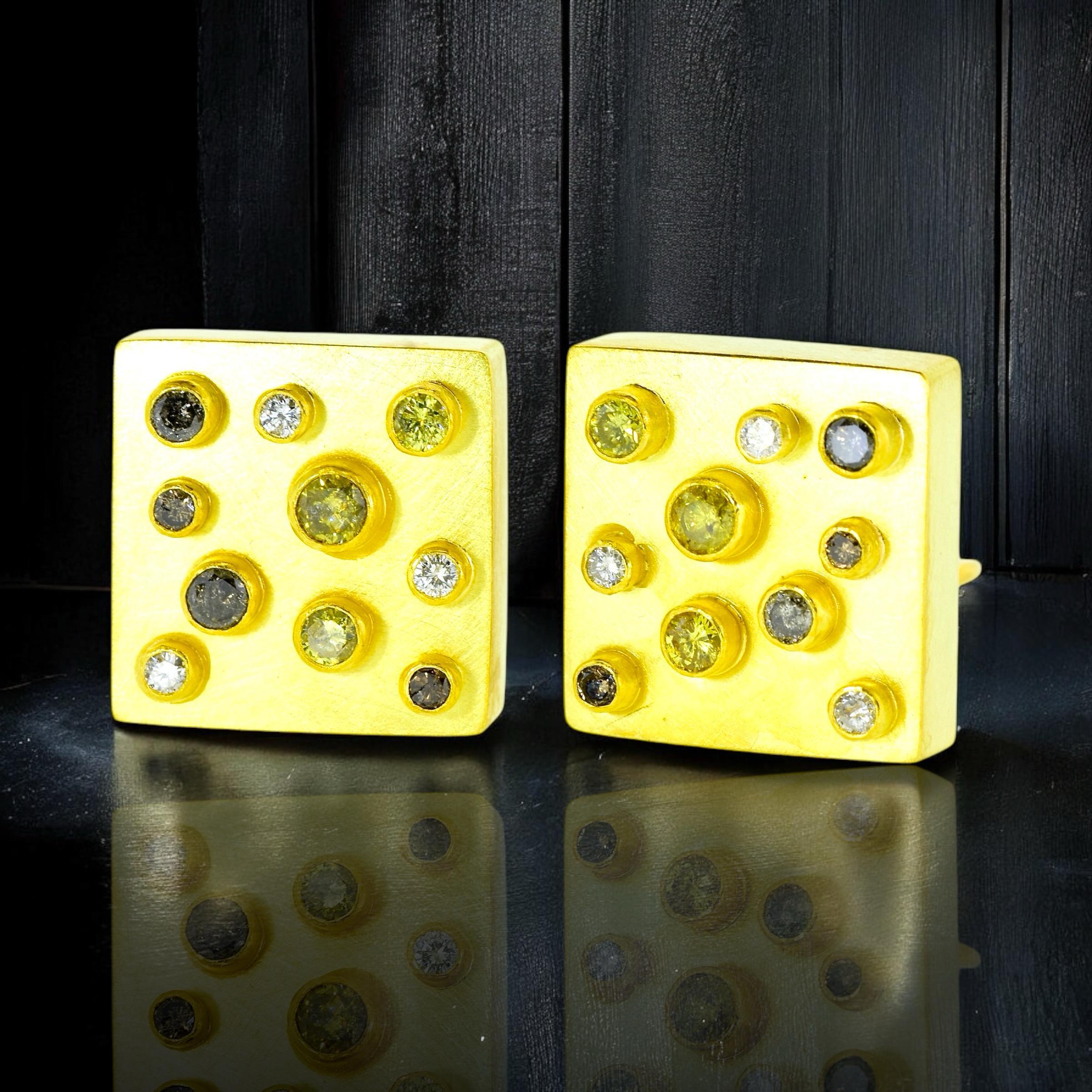 18K yellow gold earrings with a total of 20 round brilliant cut diamonds bezel set on these square cube like earrings. The diamonds range from white (near colorless) to fancy yellows and fancy rootbeer colored diamonds. The weights have been
