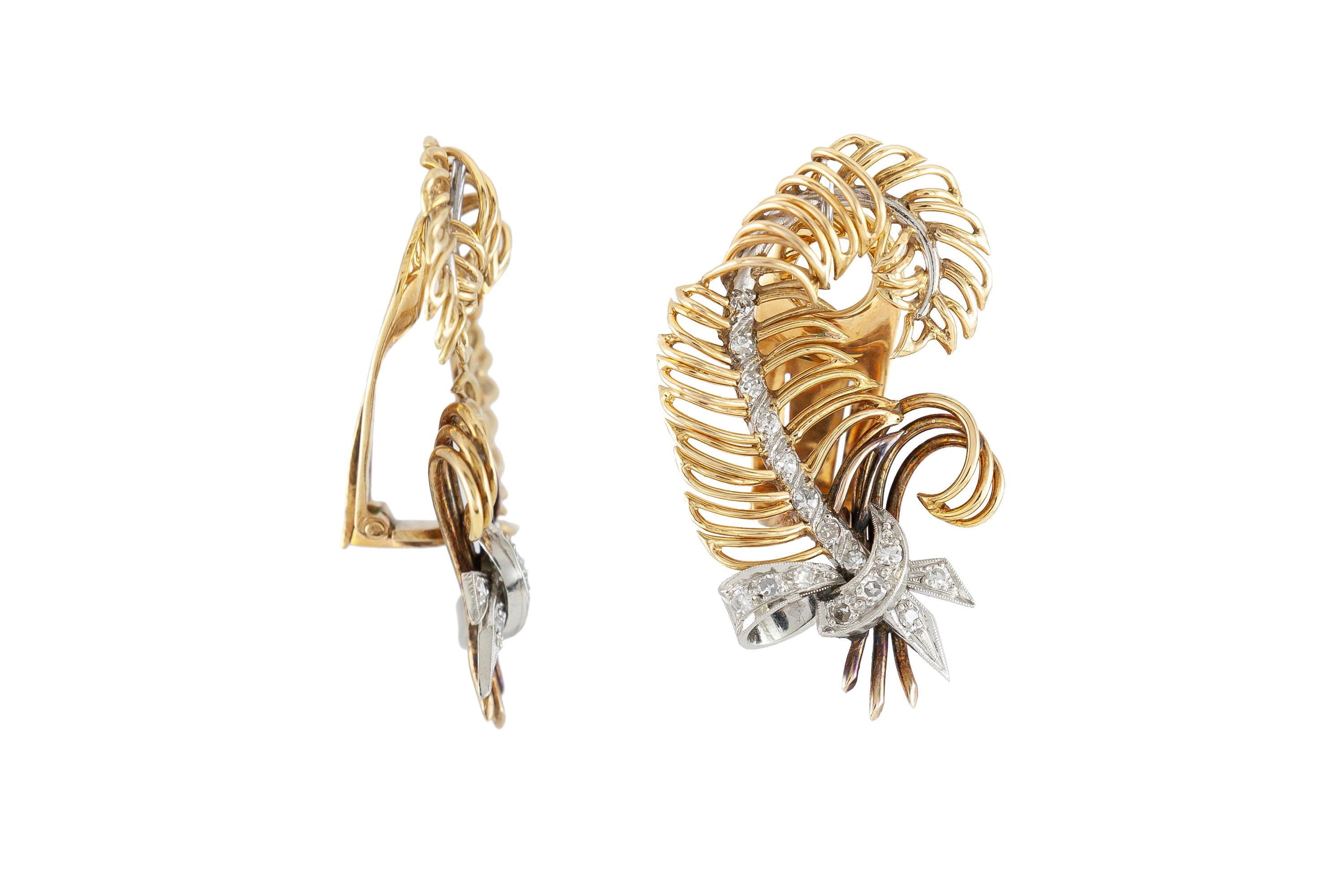 The earrings are finely crafted in 18k yellow gold with diamonds weighing approximately a total of 0.40 carat.

