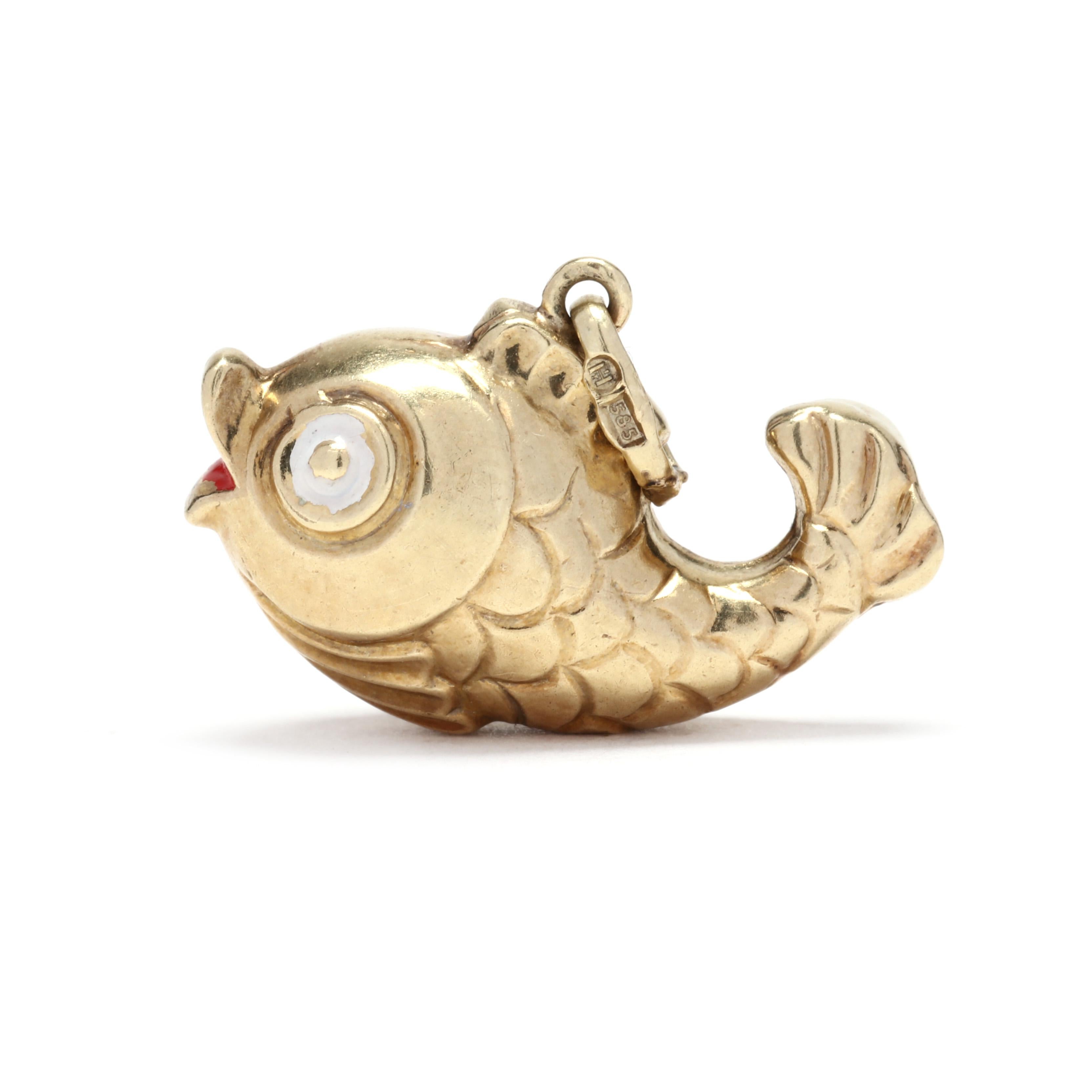 A vintage 14 karat yellow gold and enamel fish charm. This charm features a curved fish motif with stamped scales and with red and white enamel detailed eyes and mouth.



Length: 5/8 in.



Width: 3/4 in.



Weight: .6 dwts.