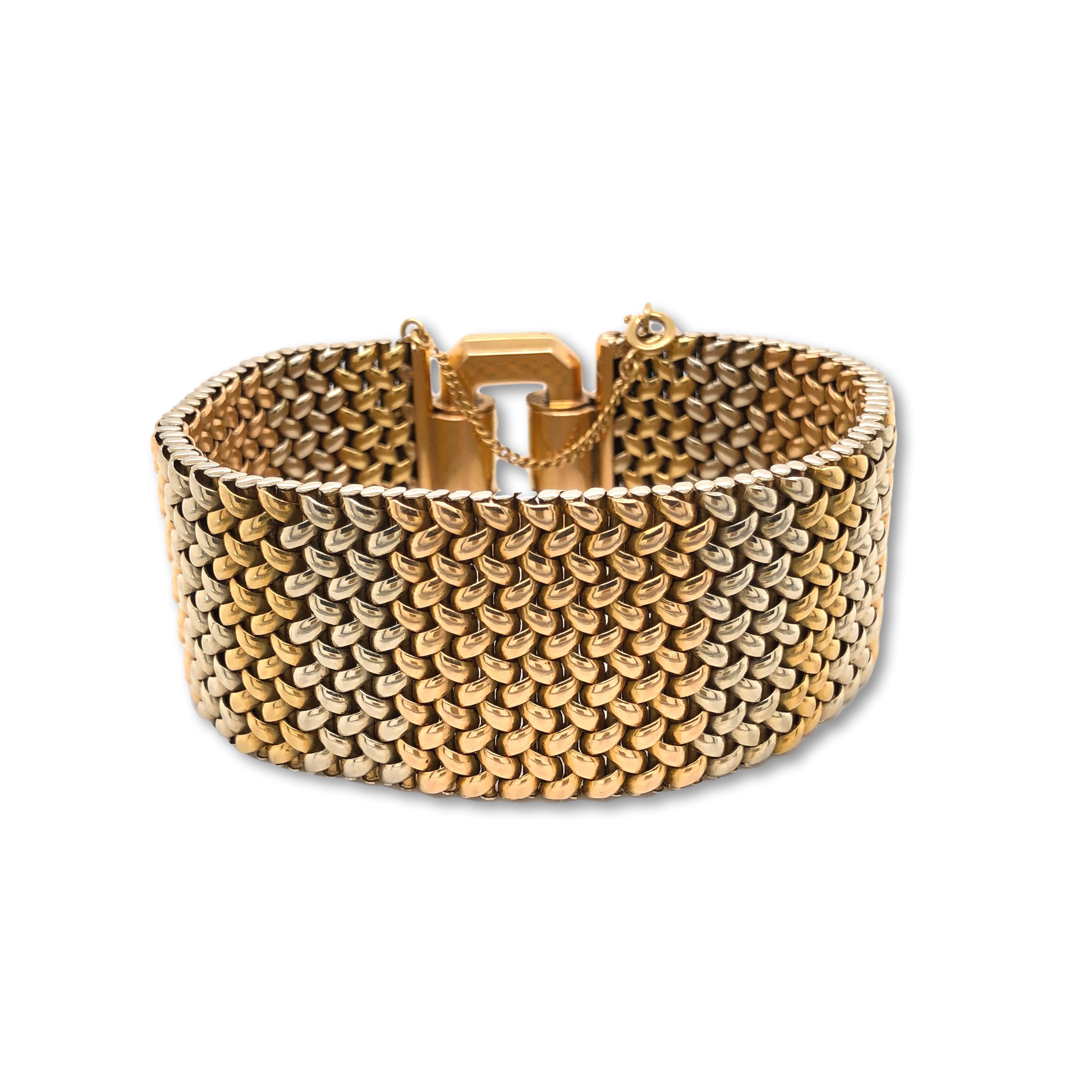 This Flexible Tri-Colored Gold Bracelet is of Italian Design and weighs 121.9 grams and measures 8 inches in length 