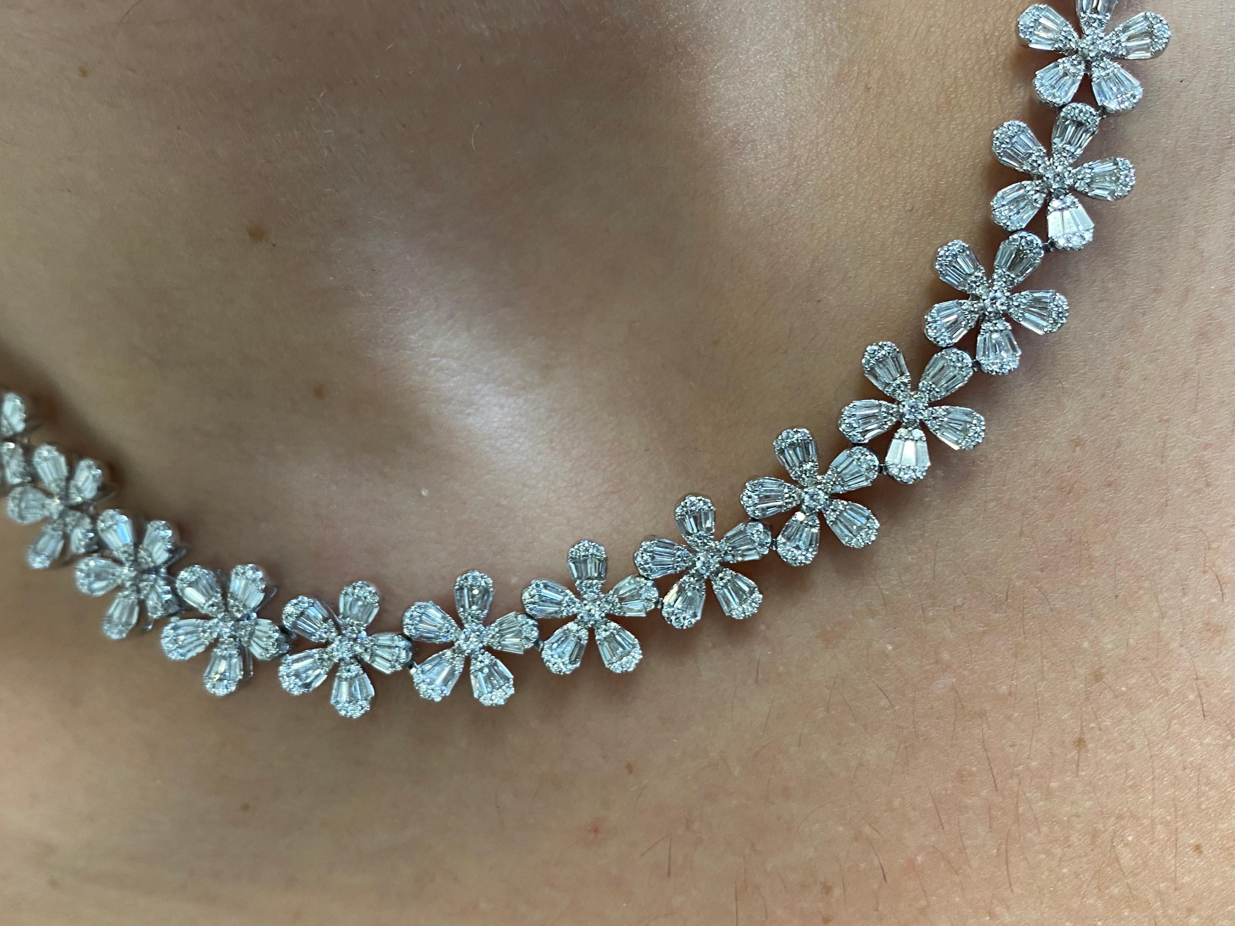 Flower daisy necklace set in 18K white gold. The necklace is set with a cluster of baguette and round diamonds. The color of the stones are F, the clarity is VS1-VS2. The total diamonds weight is 4.95 carats. The necklace is 18 Inches, but can be